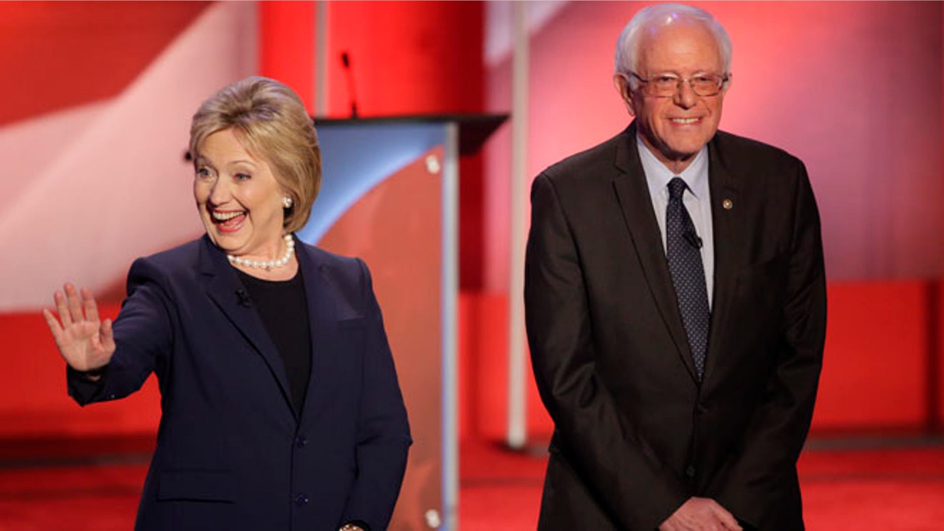 Democratic presidential candidate, Hillary Clinton and Democratic presidential candidate, Sen. Bernie Sanders, I-Vt, greet the audience before a Democratic presidential primary debate hosted by MSNBC at the University of New Hampshire Thursday, Feb. 4, 2016, in Durham, N.H. (AP Photo/David Goldman)