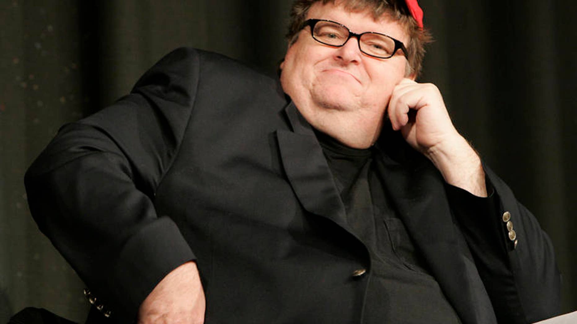 Filmmaker Michael Moore’s proposal to release crime scene photographs from Sandy Hook Elementary School would be a 'horrendous offense' to relatives of victims, Dorrie Carolan, co-president of the Newtown Parent Connection, Inc., told FoxNews.com. (AP)