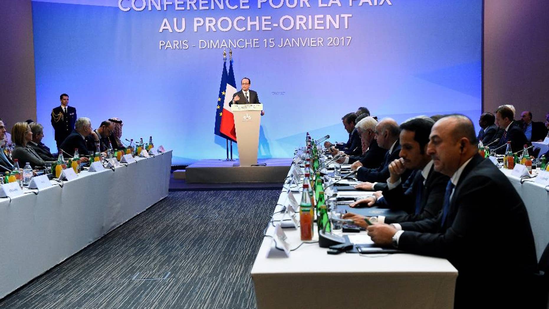 French President Francois Hollande delivers his speech at the opening of the Mideast peace conference in Paris, Sunday, Jan. 15, 2017. Fearing a new eruption of violence in the Middle East, more than 70 world diplomats gathered in Paris on Sunday to push for renewed peace talks that would lead to a Palestinian state. (Bertrand Guay/Pool Photo via AP)