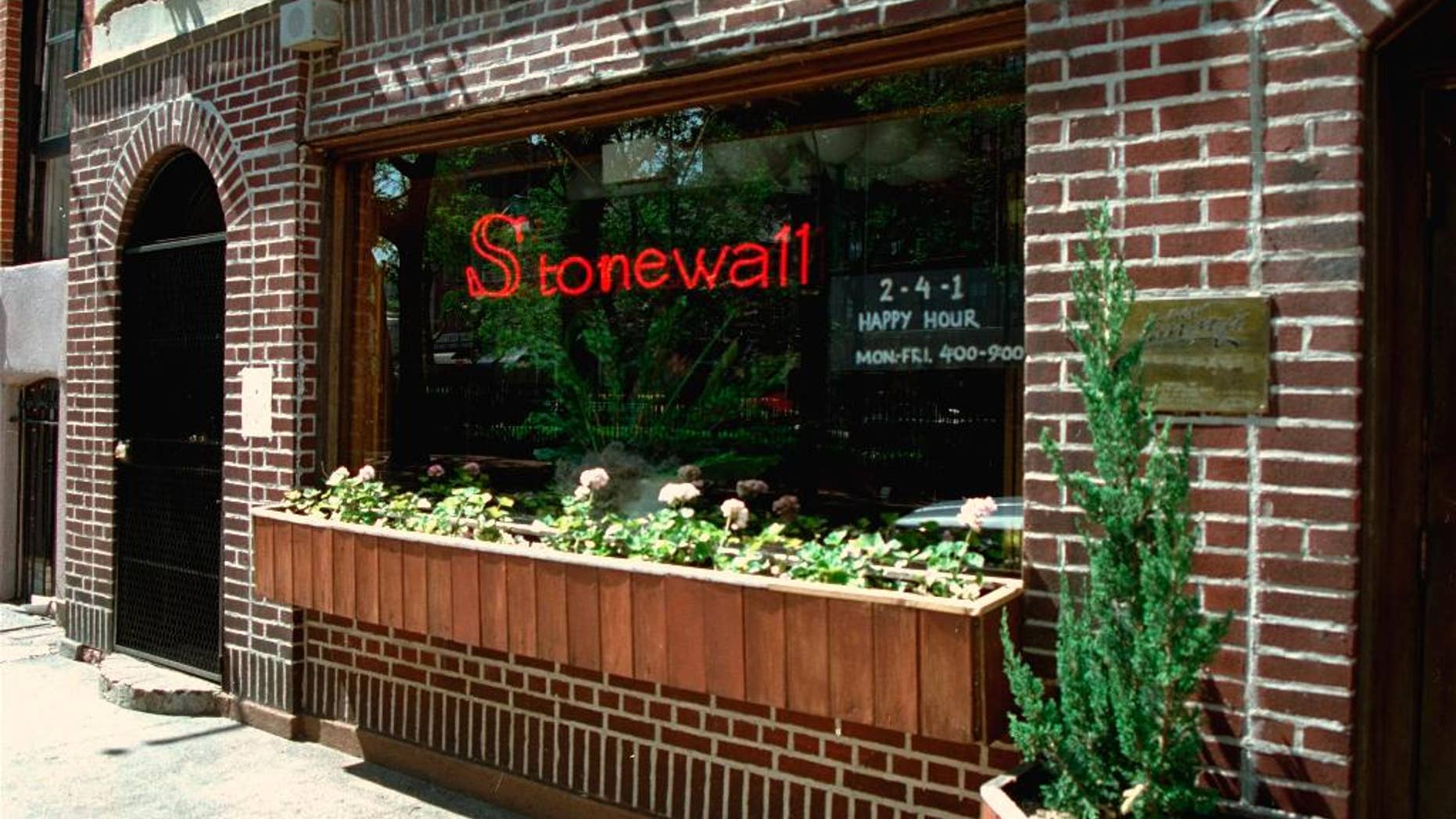 FILE - This May 1994 file photo shows an exterior view of the Stonewall Inn in the Greenwich Village section of New York, site of the 1969 riot that sparked the Gay Rights Movement. New York City police are searching for a man suspected of sexually assaulting a transgender woman in a bathroom at the historic Stonewall Inn bar. Police said Monday, March 28, 2016, the victim was in the unisex bathroom when the unknown man enters and apparently sexually assaults her. (AP Photo/Kevin Larkin, File)