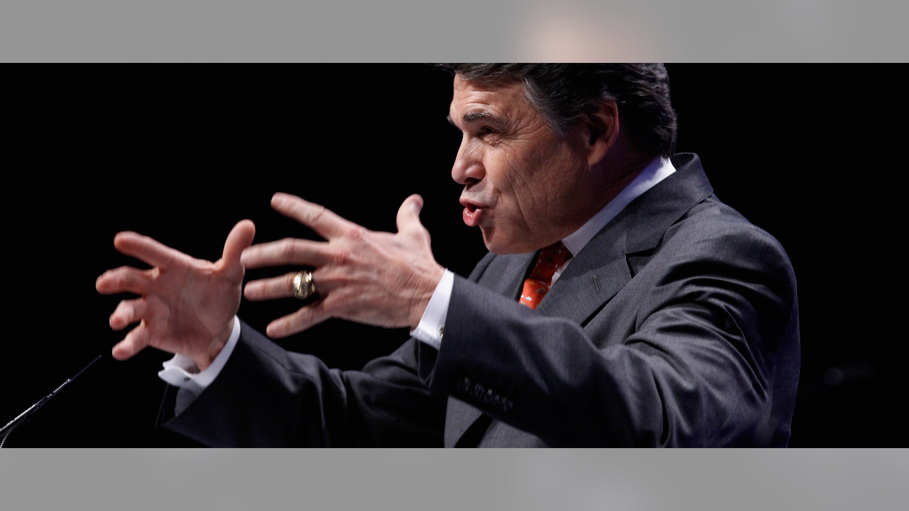 WASHINGTON, DC - FEBRUARY 11: Texas Governor Rick Perry addresses the Conservative Political Action Conference at the Marriott Wardman Park February 11, 2011 in Washington, DC. A dozen potential Republican presidental hopefuls are set to address CPAC, the largest gathering of conservative activists in the country. (Photo by Chip Somodevilla/Getty Images) *** Local Caption *** Rick Perry