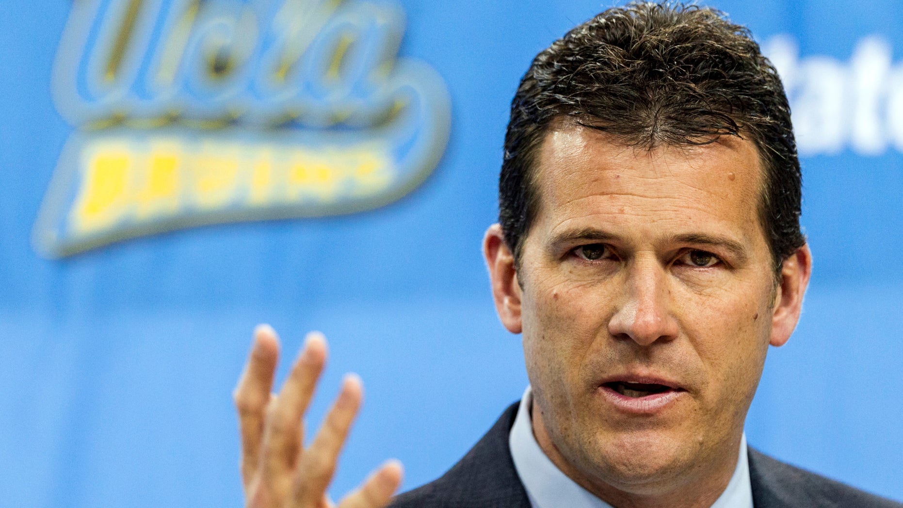 CORRECTS MONTH - Steve Alford, UCLA's new men's basketball coach, gestures during a news conference at the Pauley Pavilion in Los Angeles, Tuesday, April 2, 2013. Alford was hired on Saturday, spurning New Mexico days after he agreed to a new 10-year deal with the Lobos for a chance to run what he called "the premier basketball program in the country." (AP Photo/Damian Dovarganes)