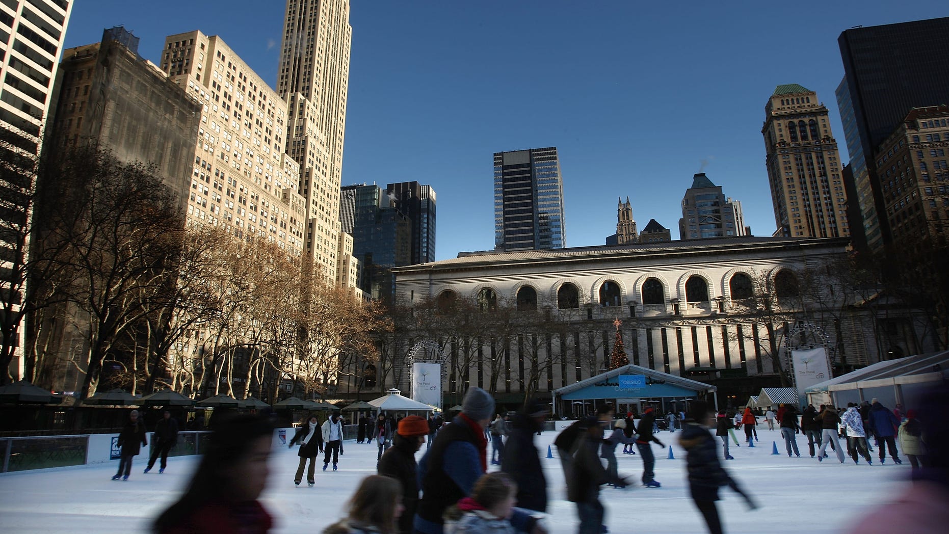 NEW YORK - JANUARY 03: Ice skaters skate on the rink at Bryant Park January 3, 2008 in New York City. While much of the East Coast is experiencing freezing temperatures, significantly warmer weather is forecast for the weekend. (Photo by Spencer Platt/Getty Images)