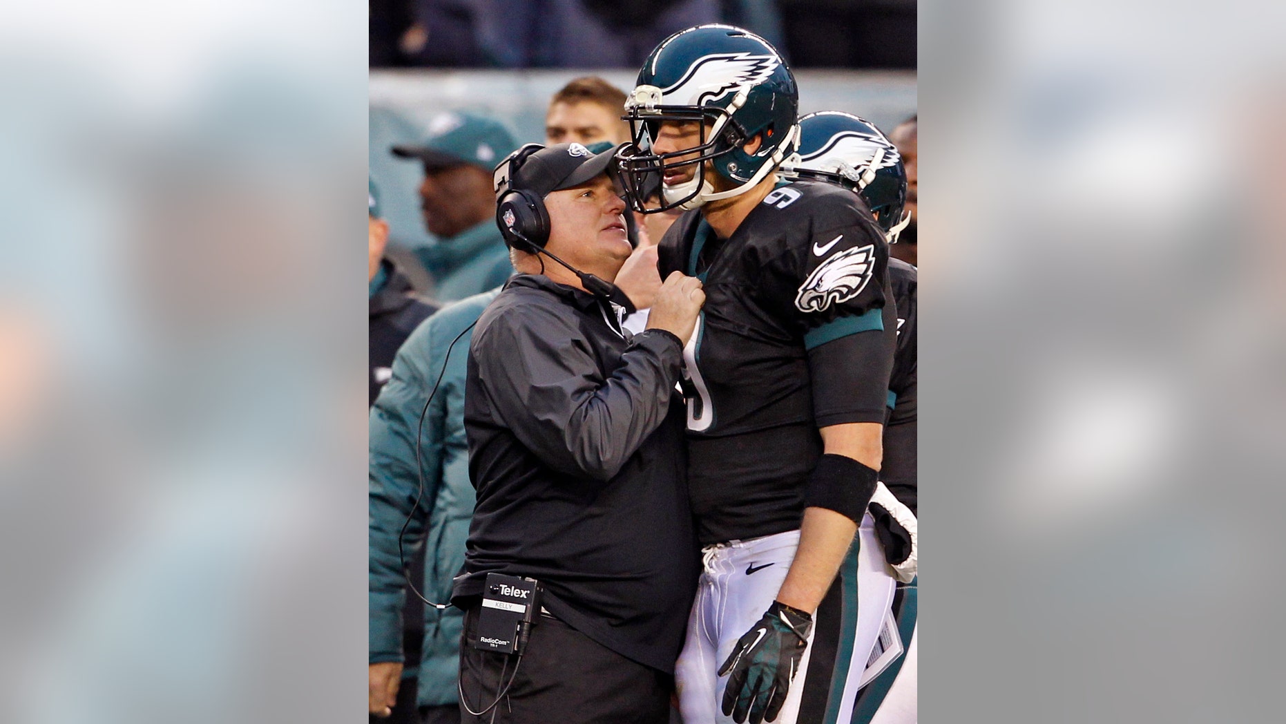 Philadelphia Eagles head coach Chip Kelly talks to Nick Foles during the second half of an NFL football game against the Arizona Cardinals on Sunday, Dec. 1, 2013, in Philadelphia. (AP Photo/The Philadelphia Inquirer, Ron Cortes) PHIX OUT; TV OUT; MAGS OUT; NEWARK OUT