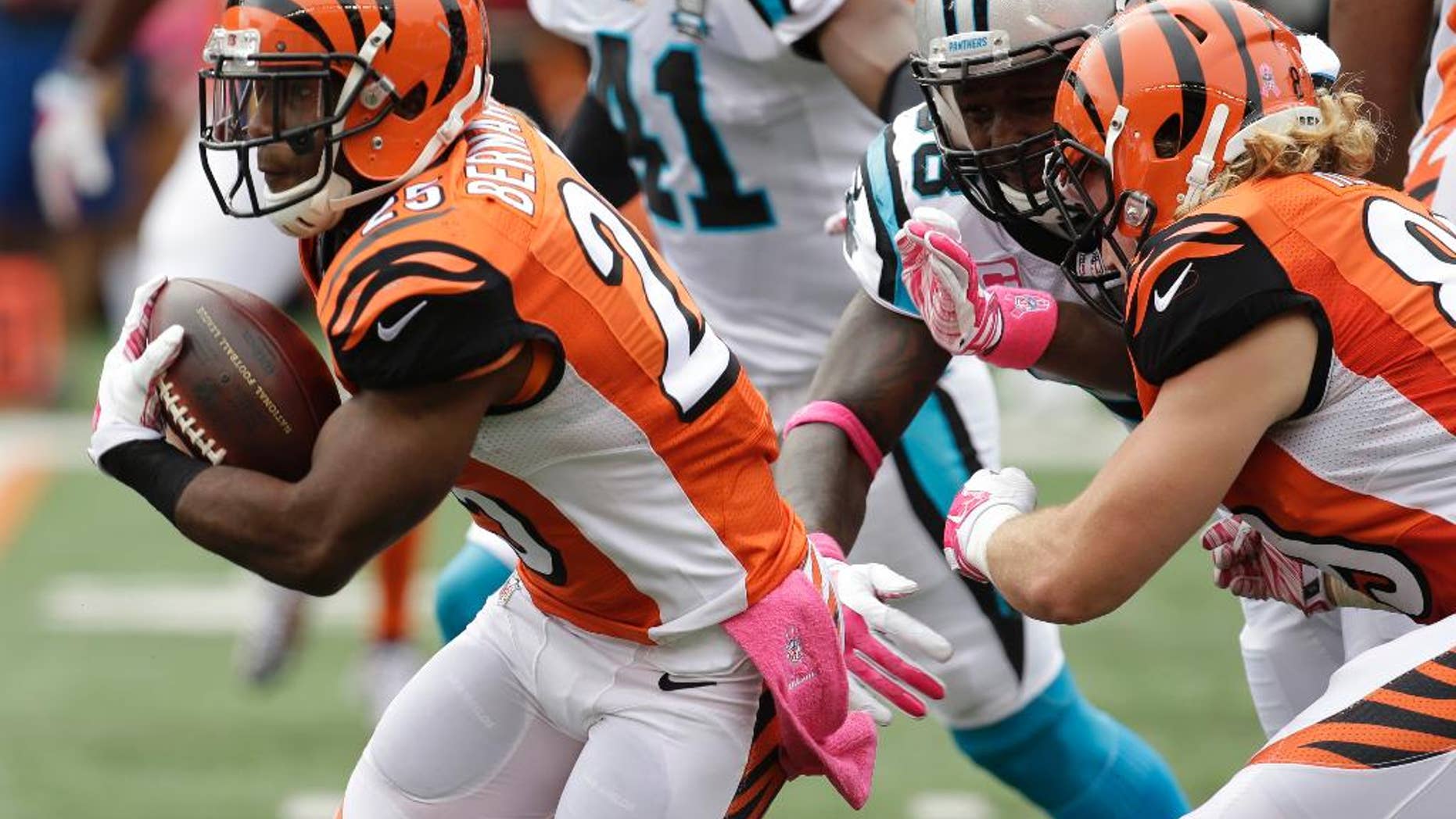 Cincinnati Bengals running back Giovani Bernard (25) breaks thru the line on his way to an 89-yard touchdown run against the Carolina Panthers in the first half of an NFL football game, Sunday, Oct. 12, 2014, in Cincinnati. (AP Photo/AJ Mast)