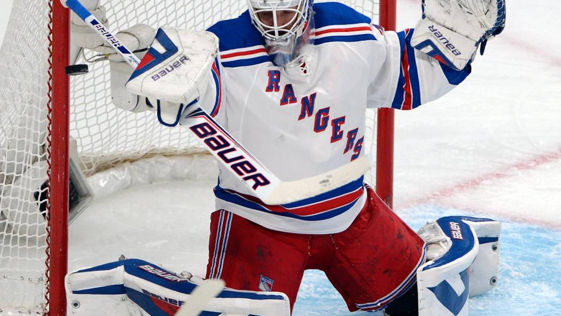 New York Rangers goalie Henrik Lundqvist makes a save against the Montreal Canadiens during the first period in Game 2 of the NHL hockey Eastern Conference final Stanley Cup playoff series Monday, May 19, 2014 in Montreal. (AP Photo/The Canadian Press, Ryan Remiorz)