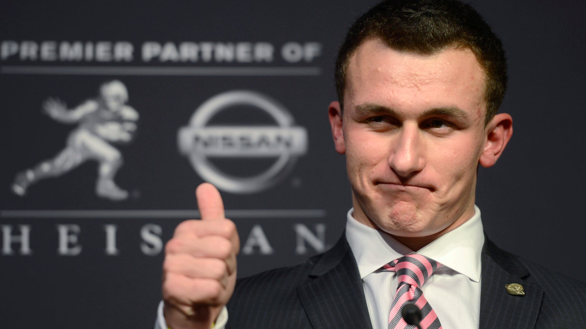 Dec. 8, 2012: Texas A&M quarterback Johnny Manziel talks to reporters after winning the Heisman Trophy.