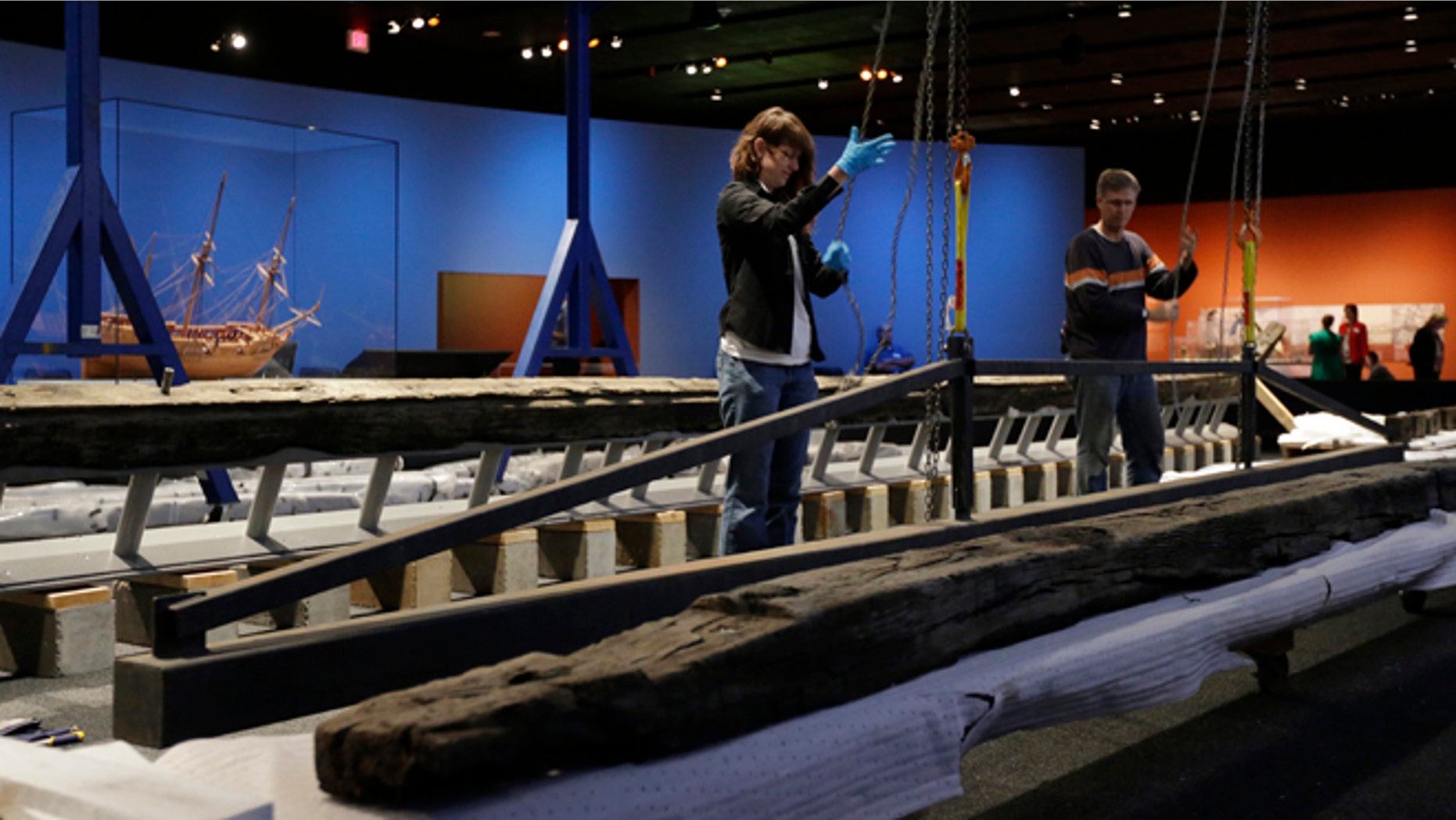 In this Oct. 22, 2014 photo work to reassemble the 54-foot oak French frigate La Belle begins at the Bullock Texas State History Museum in Austin, Texas. Archaeologists are beginning to reassemble the remains of the ship recovered more than 300 years after the vessel was lost in a storm off the coast of Texas. (AP Photo/Eric Gay)