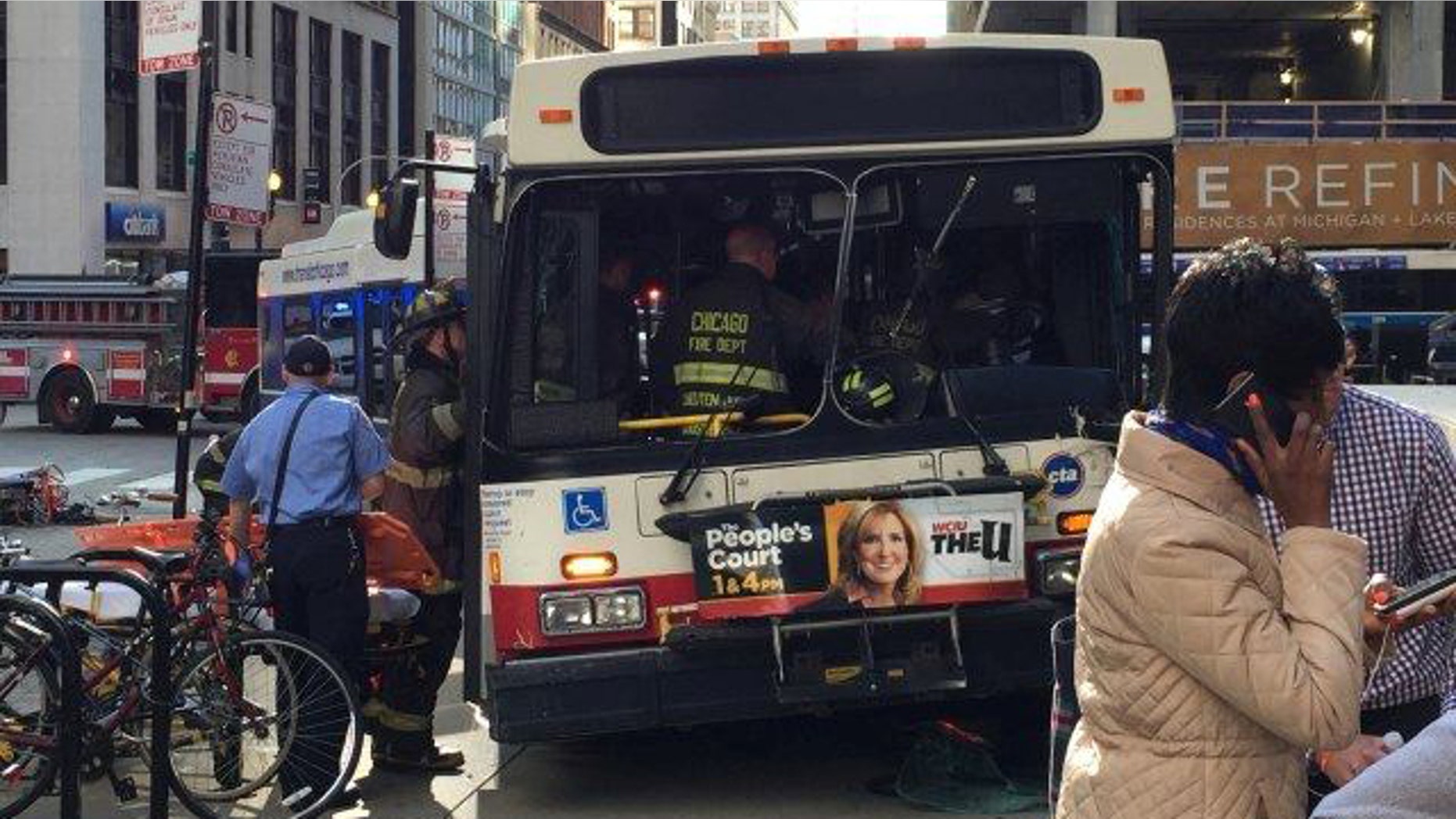 June 2, 2015: Emergency workers board a Chicago Transit Authority bus that jumped the curb, killing one person and injuring eight others in downtown Chicago during afternoon rush hour. (courtesy MyFoxChicago.com)