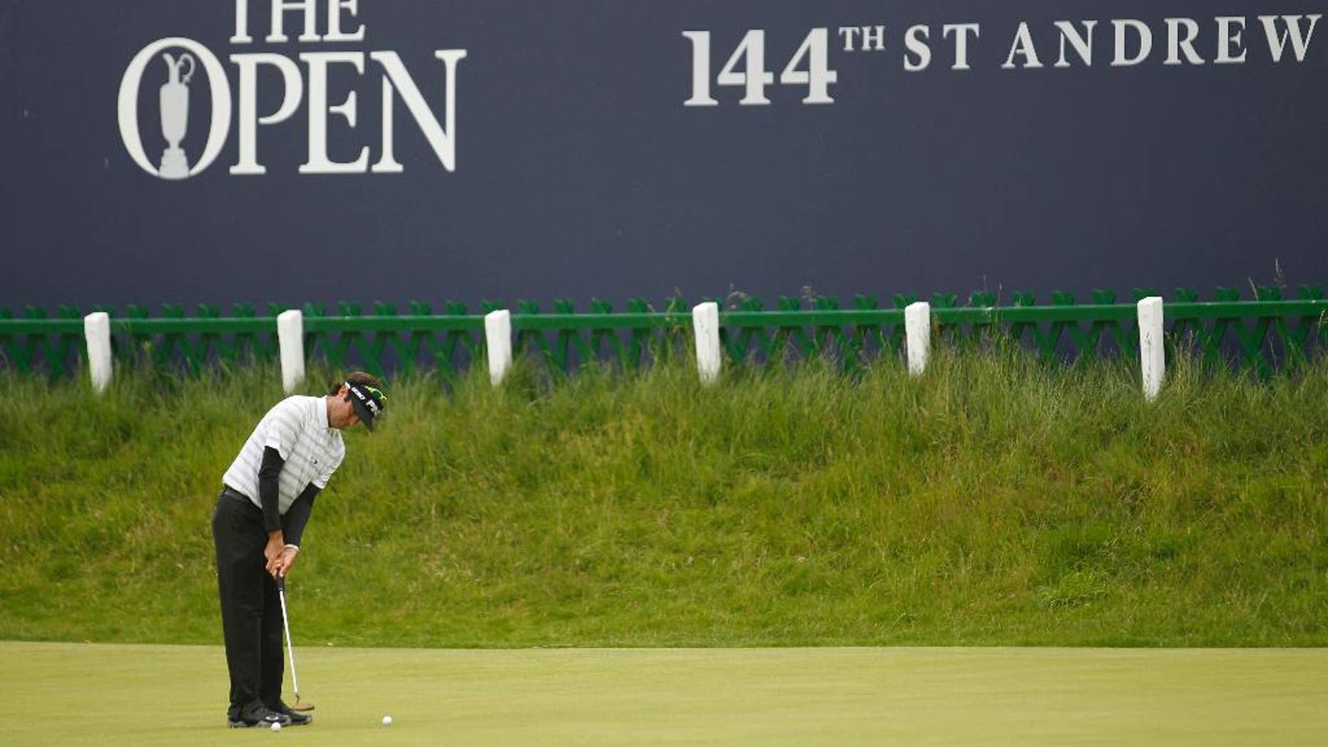 Bubba Watson from the U.S putts on the 18th green during a practice round at St. Andrews Golf Club prior to the start of the British Open Golf Championship, in St. Andrews, Scotland, Monday, July 13, 2015. (AP Photo/Peter Morrison)