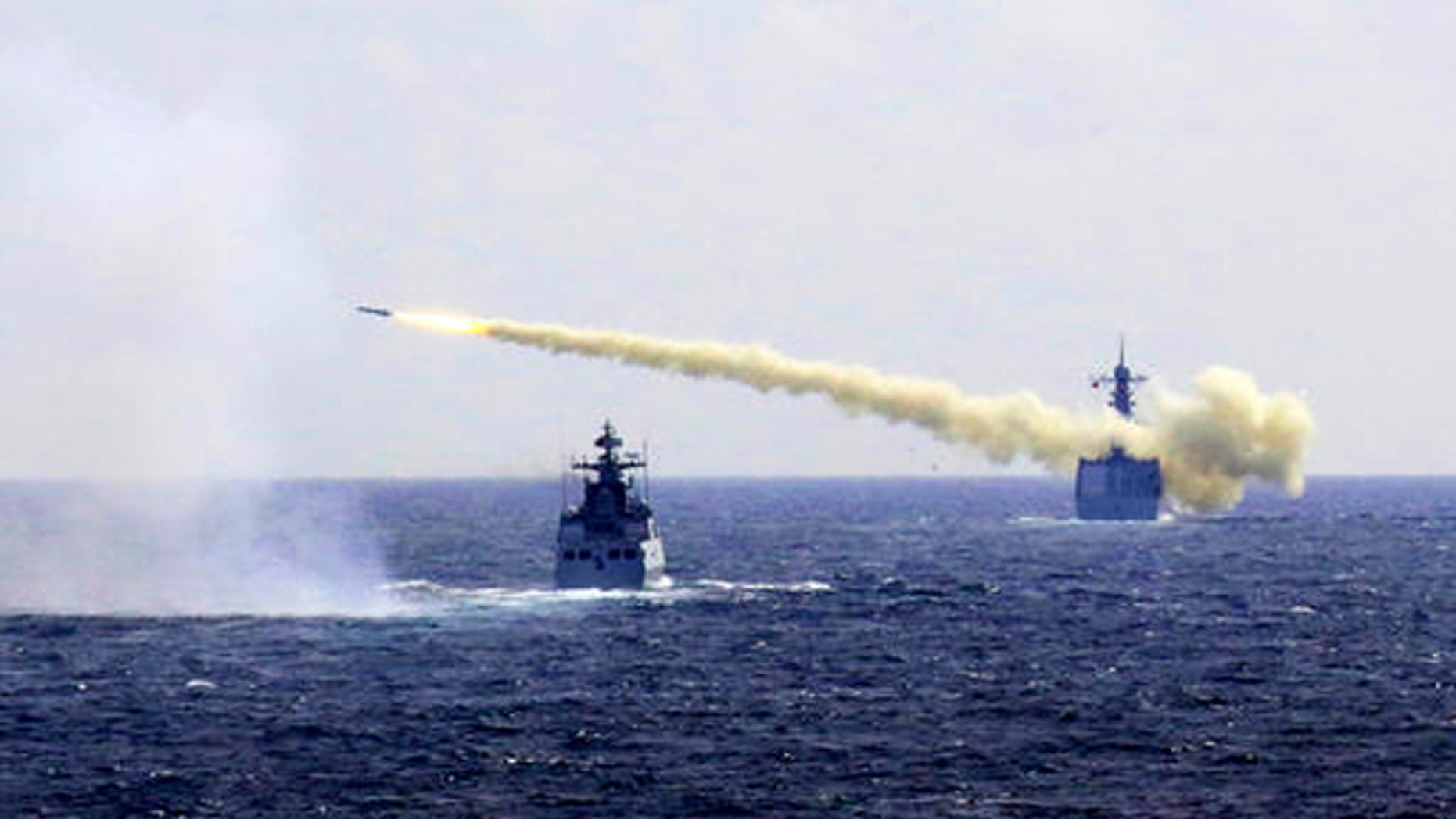 In this Monday, Aug. 1, 2016 photo released by Xinhua News Agency, a missile is launched from a navy ship during a live ammunition drill in the East China Sea. (Associated Press)