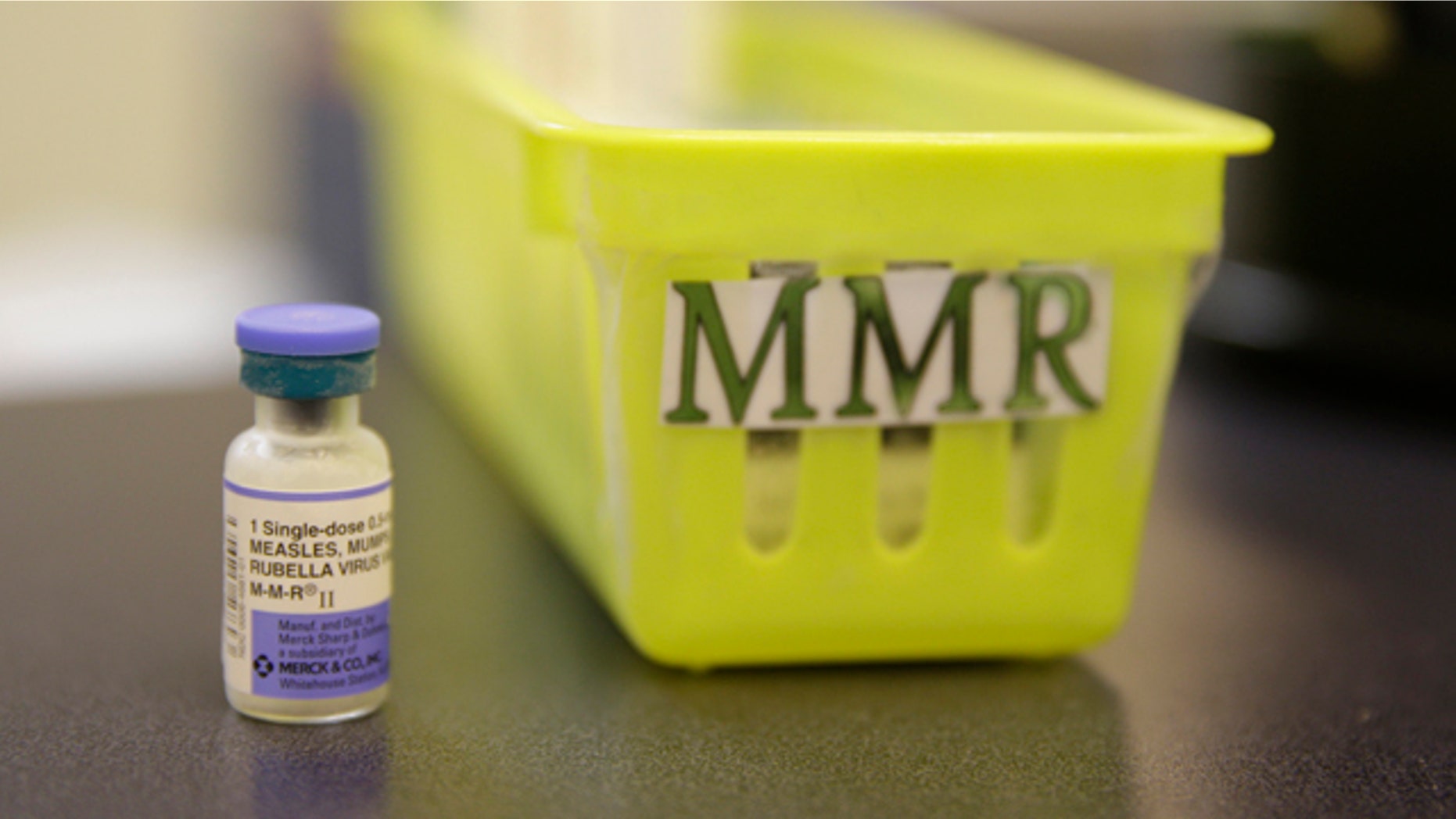 FILE- This Feb. 6, 2015, file photo shows a measles vaccine on a countertop at the Tamalpais Pediatrics clinic in Greenbrae, Calif. The Australian government has ramped up pressure on parents who oppose vaccination by threatening to withhold child care and other payments from families that fail to immunize their children. (AP Photo/Eric Risberg, File)