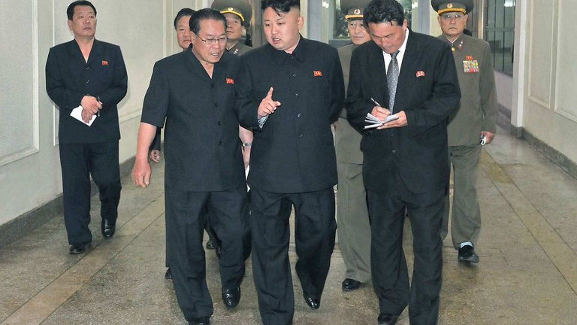 This photo, released by North Korea's official Korean Central News Agency (KCNA) on June 18, 2013, shows N.Korean leader Kim Jong-Un (C) visiting a machine plant in North Phyongan Province. Kim reportedly gave copies of Adolf Hitler's "Mein Kampf" to his top officials, urging them to study it as a leadership skills manual.