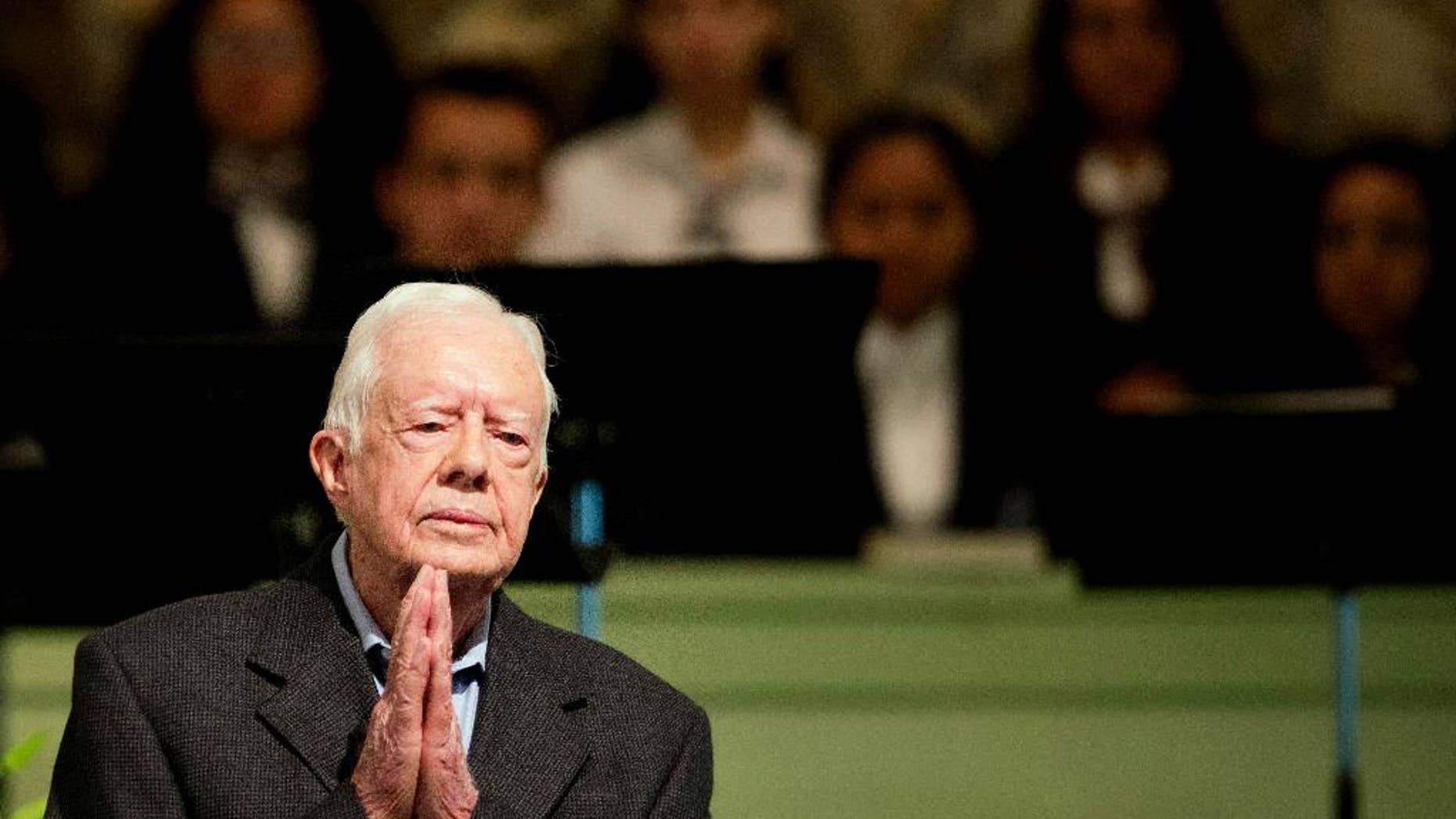 Former President Jimmy Carter teaches Sunday School class at Maranatha Baptist Church in his hometown Sunday, Aug. 23, 2015, in Plains, Ga. The 90-year-old Carter gave one lesson to about 300 people filling the small Baptist church that he and his wife, Rosalynn, attend. It was Carter's first lesson since detailing the intravenous drug doses and radiation treatment planned to treat melanoma found in his brain after surgery to remove a tumor from his liver. (AP Photo/David Goldman)