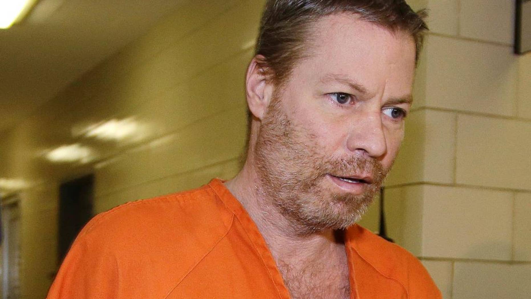 FILE - In this July 10, 2013 file photo, Mark Leonard walks to a hearing in Indianapolis. A judge is set to decide on Friday, Aug. 14, 2015, whether Leonard, who was convicted in a house explosion scheme that killed two neighbors, will be sentenced to life in prison without the possibility of parole.(AP Photo/Darron Cummings, File)