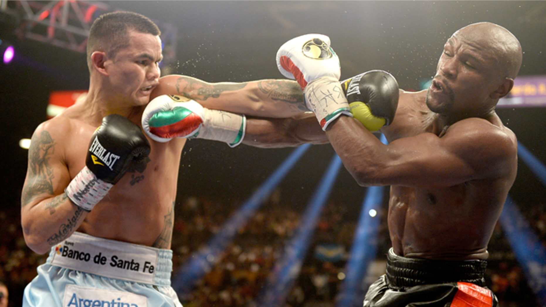 Marcos Maidana and Floyd Mayweather Jr. at the MGM Grand Garden Arena on May 3, 2014 in Las Vegas, Nevada.