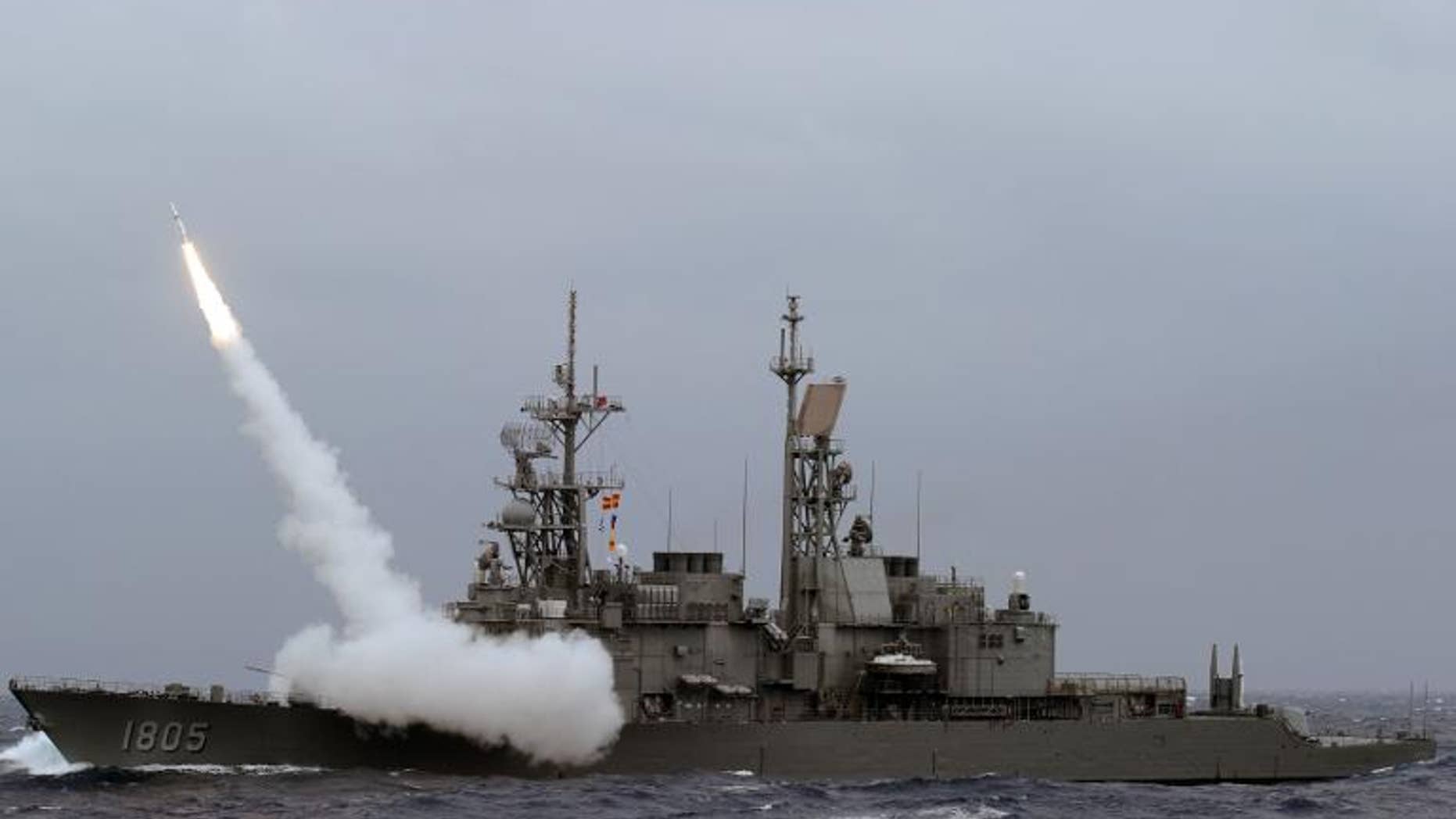 A Taiwan navy Kidd-class destoryer launches a SM-2 surface to air missile during a live fire drill at sea near the east coast of Taiwan on September 26, 2013