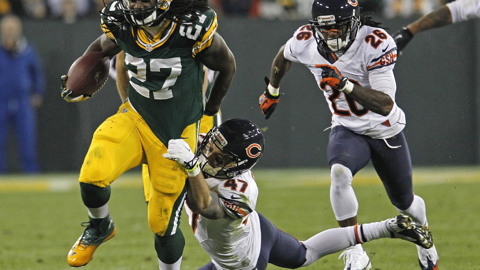 FILE - In this Nov. 4, 2013 file photo, Green Bay Packers running back Eddie Lacy is hit during a run by Chicago Bears free safety Chris Conte during an NFL football game in Green Bay, Wis. The Eagles are counting on seeing a whole lot of Lacy when they play at Green Bay on Sunday, Nov. 10, 2013. The Packers figure to give the ball to their rookie back even more now that Aaron Rodgers is out. (AP Photo/Matt Ludtke, File)