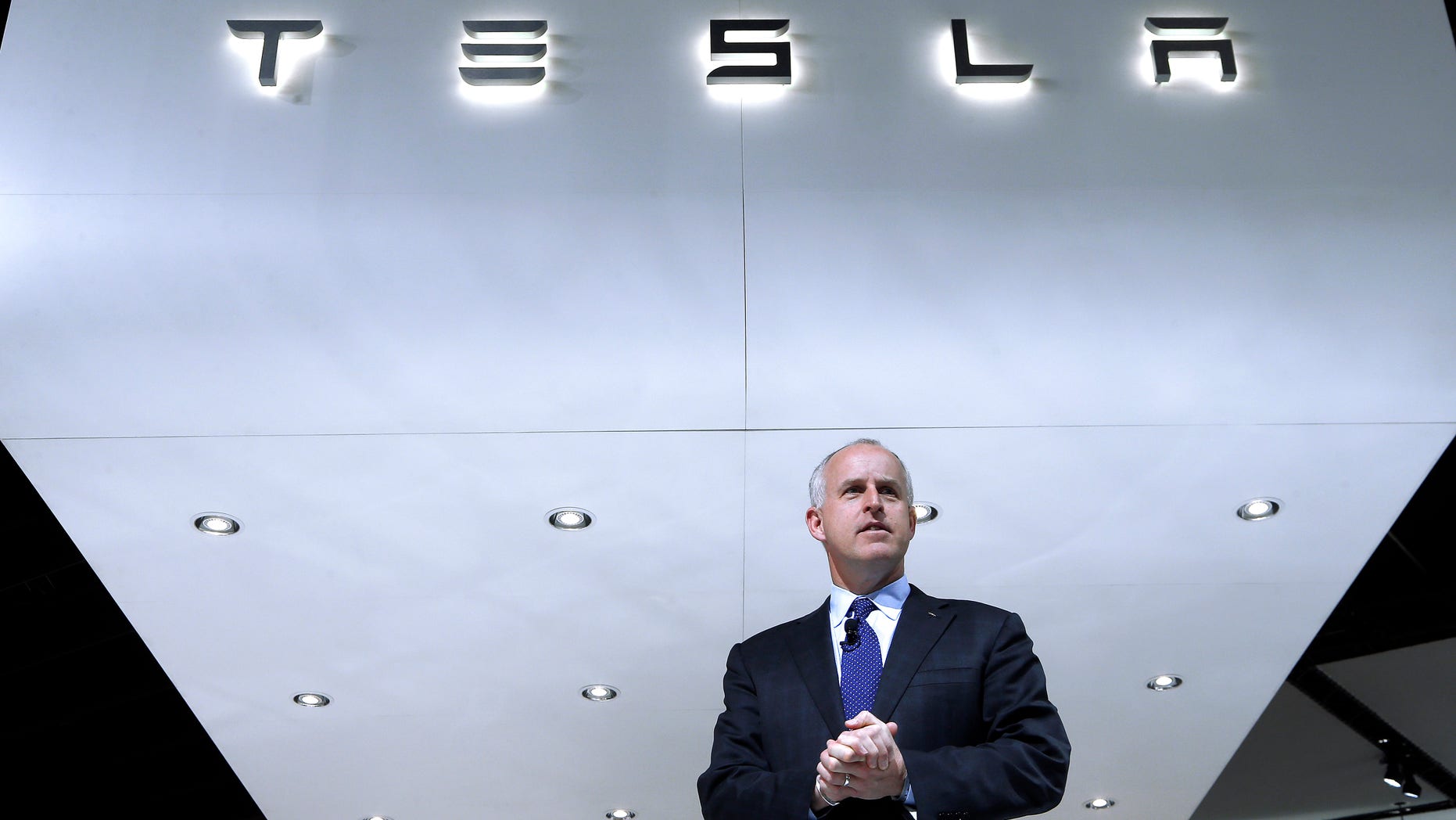 FILE - In this Jan. 14, 2014, photo, Diarmuid O'Connell, Tesla Vice President, Business Development speaks during media previews at the North American International Auto Show in Detroit. Tesla reports quarterly earnings on Wednesday, Feb. 19, 2014. (AP Photo/Paul Sancya, File)