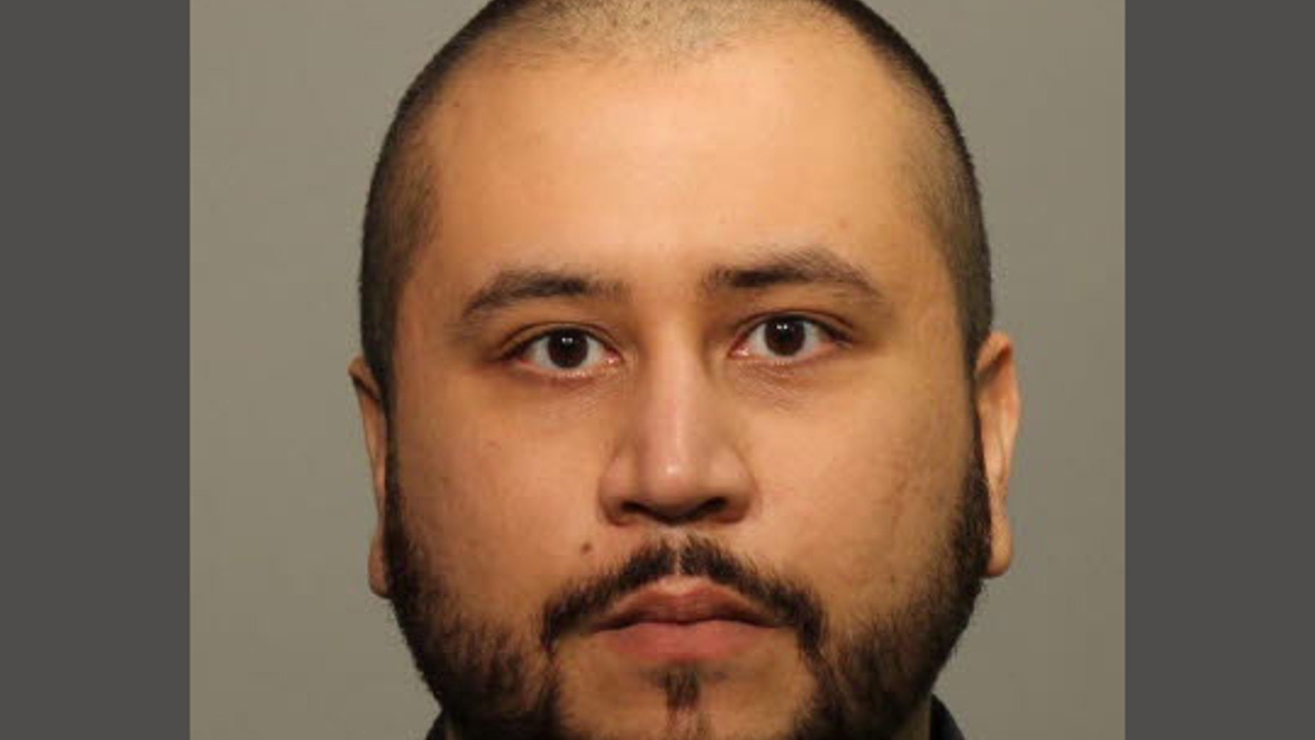 FILE - This Jan. 10, 2015, booking file photo provided by the Seminole County Public Affairs shows George Zimmerman. The U.S. Justice Department said Tuesday, Feb. 24, 2015, that the former neighborhood watch volunteer will not face federal charges in the shooting death of unarmed 17-year-old Trayvon Martin. Zimmerman was acquitted in 2013 of second-degree murder. (AP Photo/Seminole County Public Affairs, File)