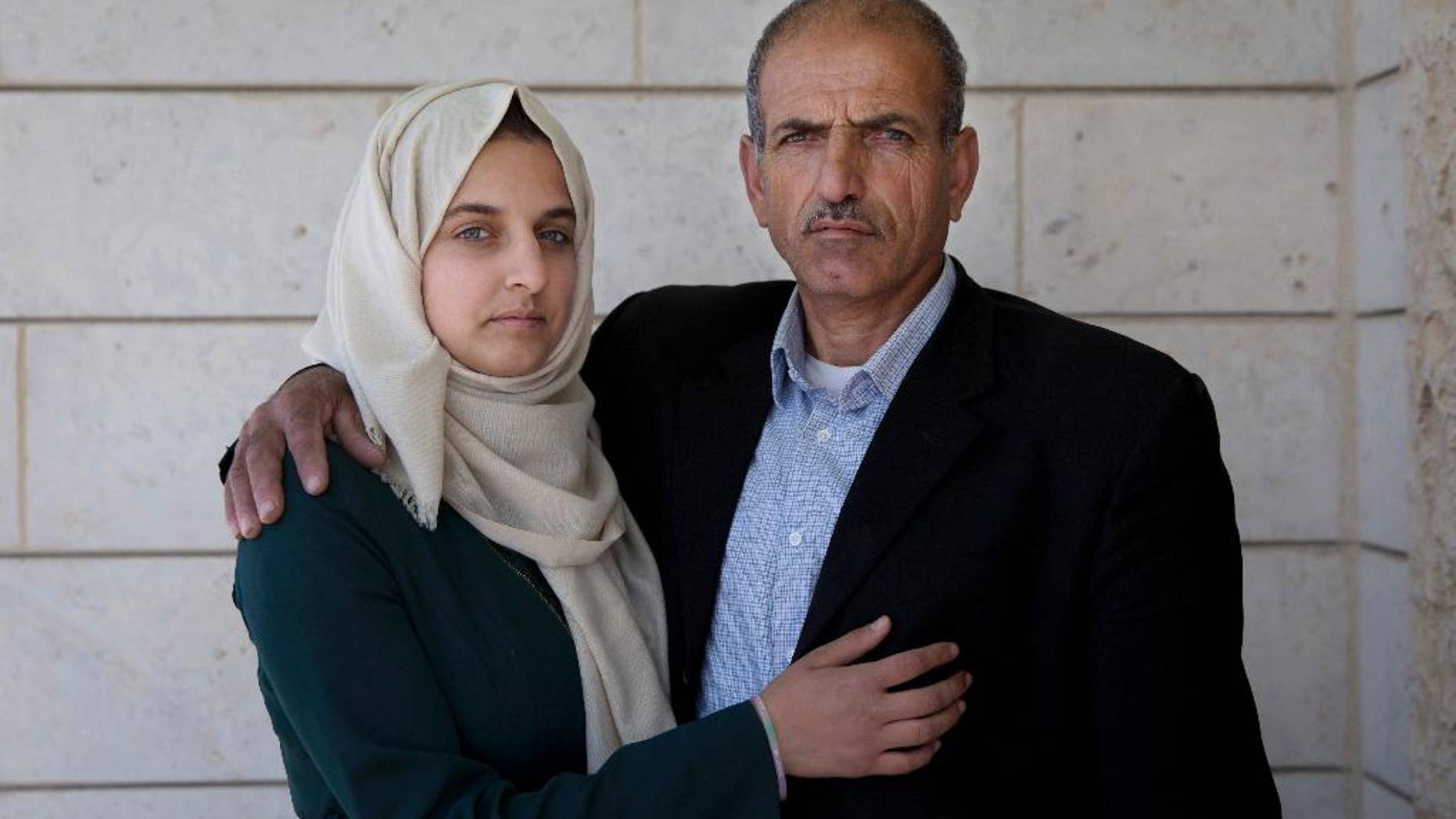 Ismail al-Wawi, 54, right and Ghayda al-Wawi, 17, the father and sister of the 12-year-old Palestinian girl imprisoned in the stabbing plot.