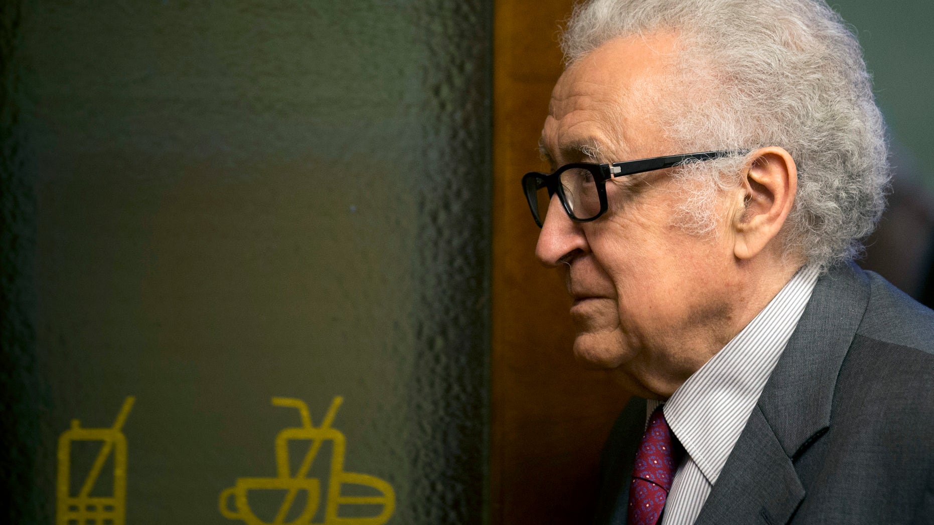 U.N. mediator for Syria Lakhdar Brahimi arrives for a press briefing at the United Nations headquarters in Geneva, Switzerland, Monday, Jan. 27, 2014. Syrians on opposite sides of their country’s civil war tried again Monday to find common ground, with peace talks focusing on an aid convoy to a besieged city that once more came under mortar attack from the government. (AP Photo/Anja Niedringhaus)