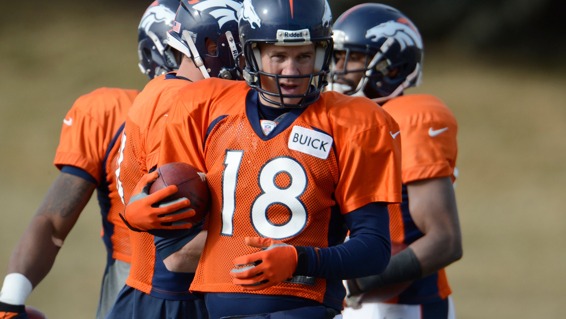 Denver Broncos quarterback Peyton Manning (18) runs through drills during the NFL football team's practice Tuesday, Jan. 8, 2013, in Englewood, Colo. The Broncos play the Baltimore Ravens at home on Saturday in a playoff game. (AP Photo/The Denver Post, John Leyba) MAGS OUT TV OUT