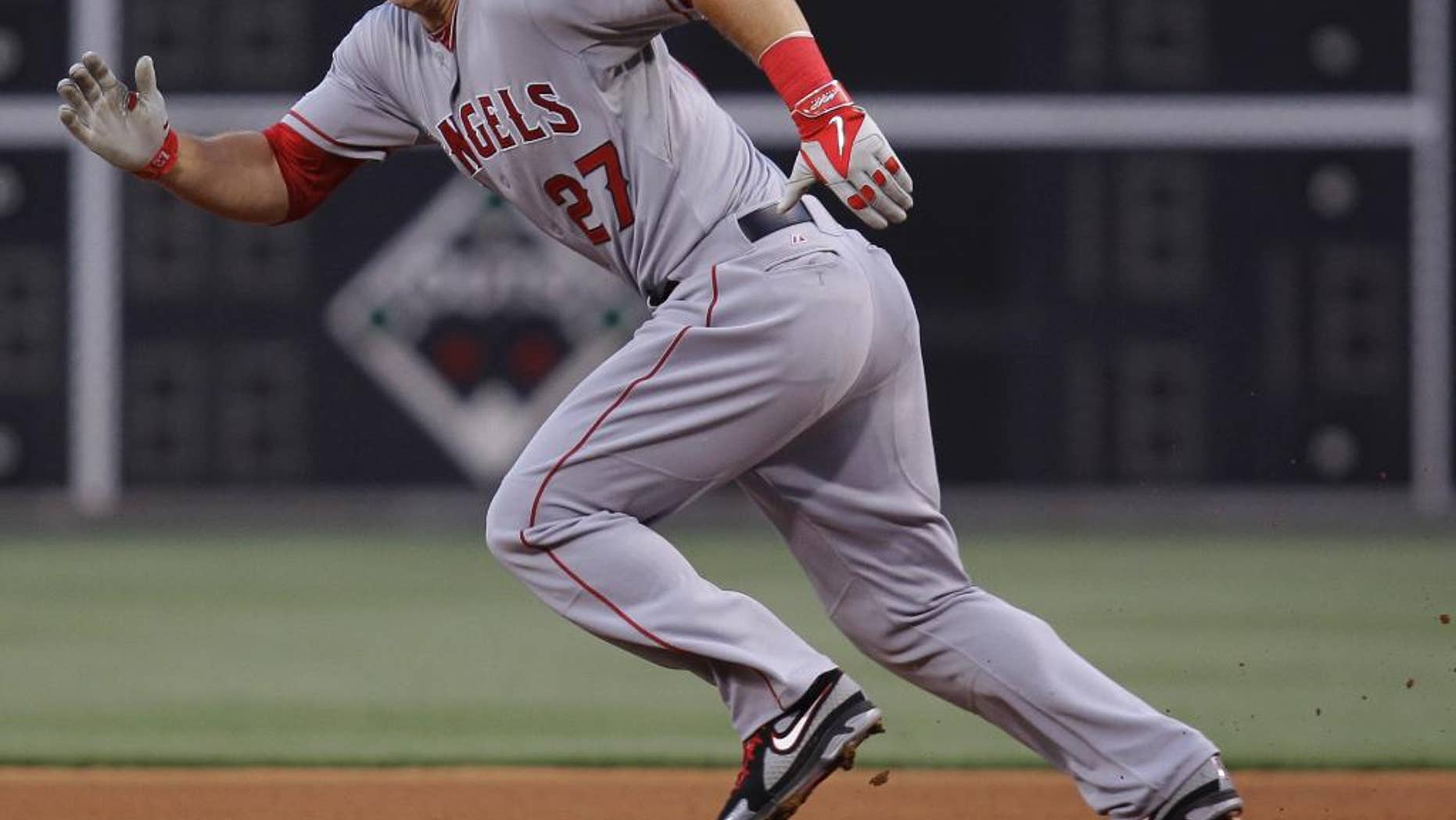 Los Angeles Angels' Mike Trout runs to second but is tagged out in the fourth inning of a baseball game with the Philadelphia Phillies, Tuesday, May 13, 2014, in Philadelphia. (AP Photo/Laurence Kesterson)