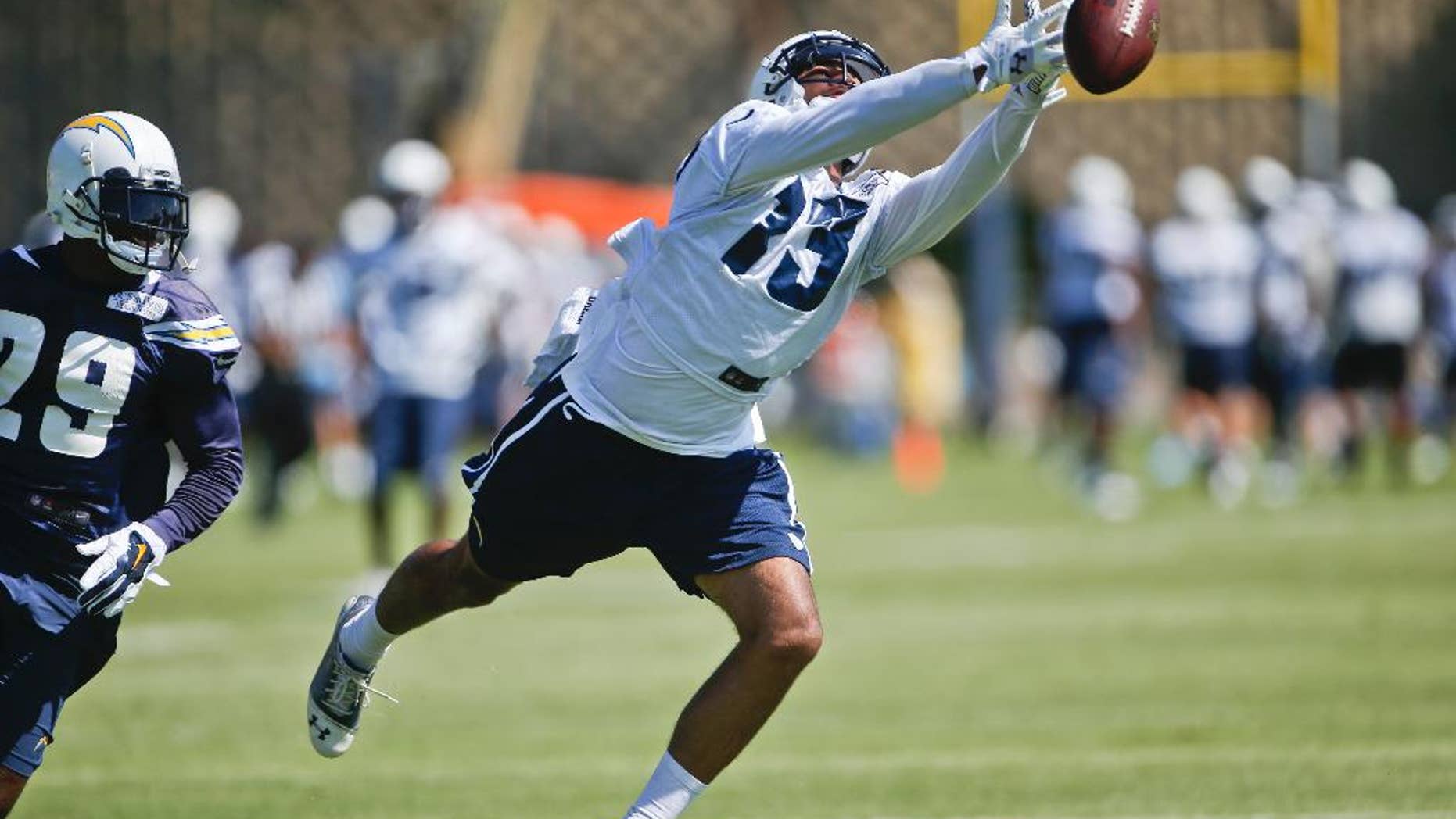 San Diego Chargers wide receiver Keenan Allen misses a finger tip catch during drills at a NFL football training camp Thursday, July 24, 2014, in San Diego. (AP Photo/Lenny Ignelzi)