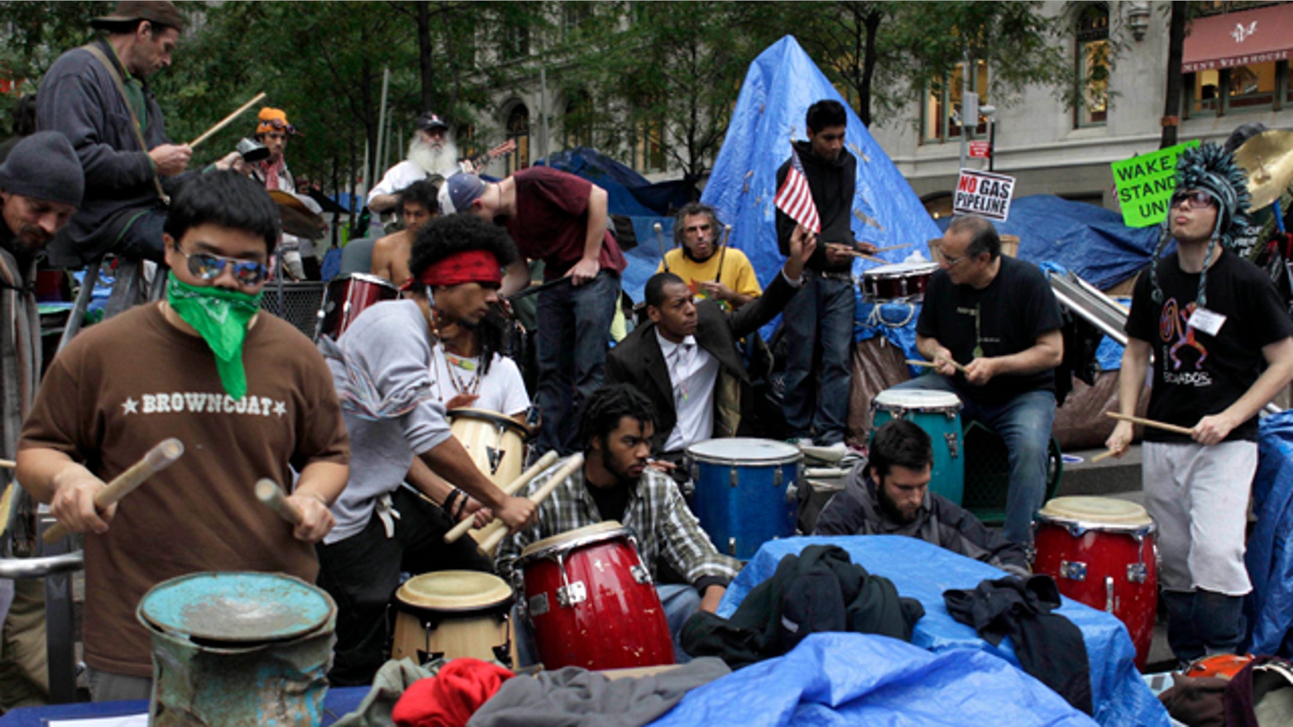Oct. 26, 2011: Occupy Wall Street protesters play drums and other percussion instruments at Zuccotti Park in New York.