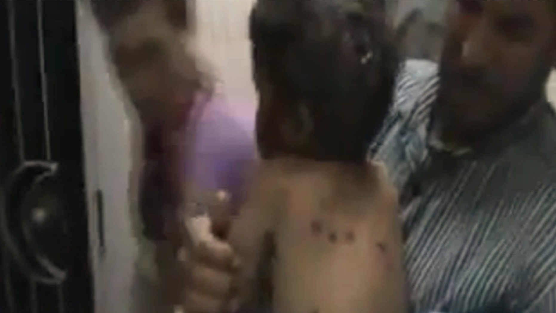 This image made from amateur video released by Shaam News Network and accessed Saturday, May 26, 2012 purports to show an injured child in Houla, Syria.