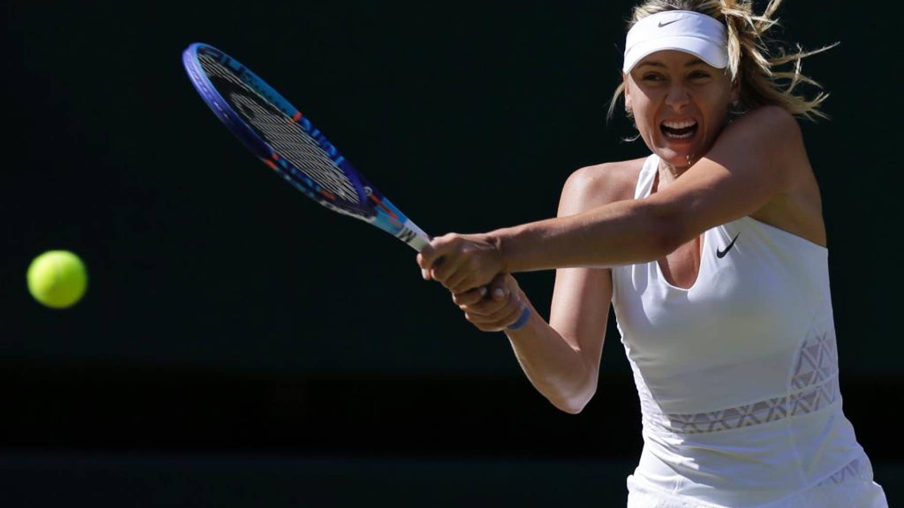 Maria Sharapova of Russia returns a shot to Serena Williams of the United States, during the women's singles semifinal match at the All England Lawn Tennis Championships in Wimbledon, London, Thursday July 9, 2015. (AP Photo/Pavel Golovkin)