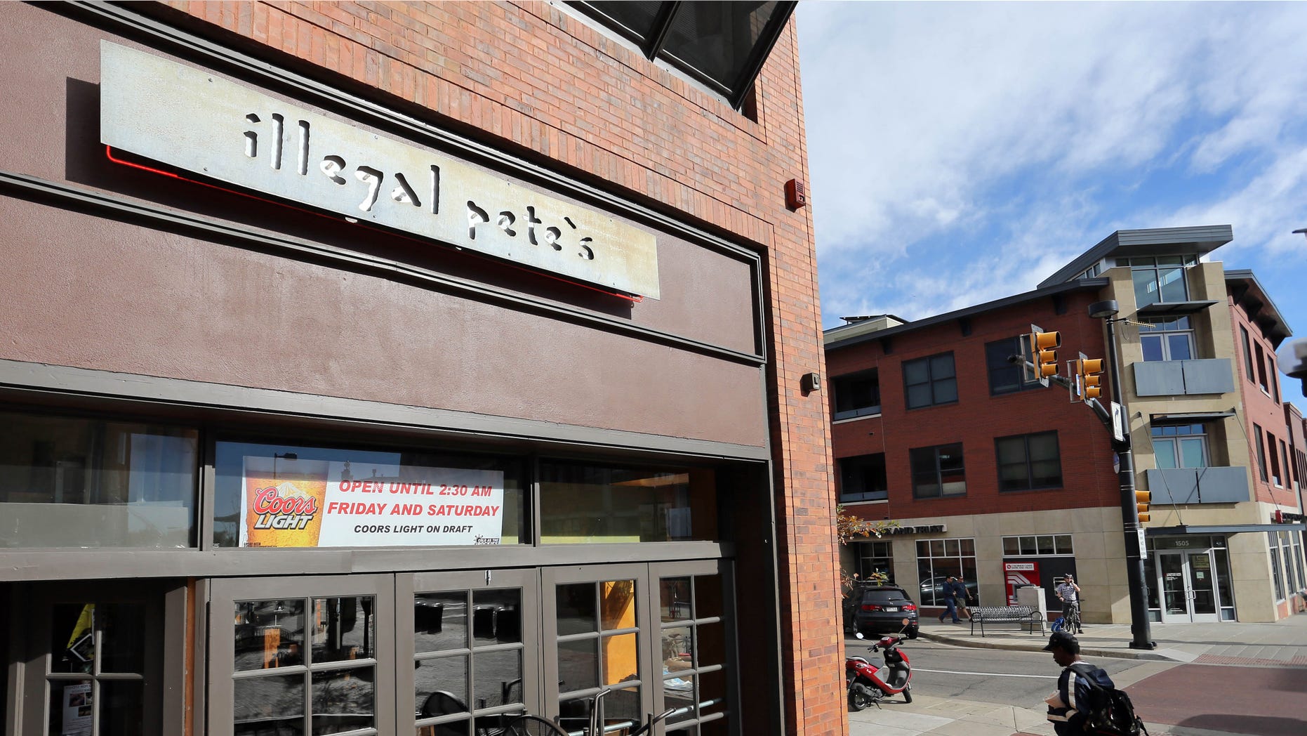 A man walks past an Illegal Pete';s restaurant, in Boulder, Colo., Thursday, Oct. 23, 2014. (AP Photo/Brennan Linsley)