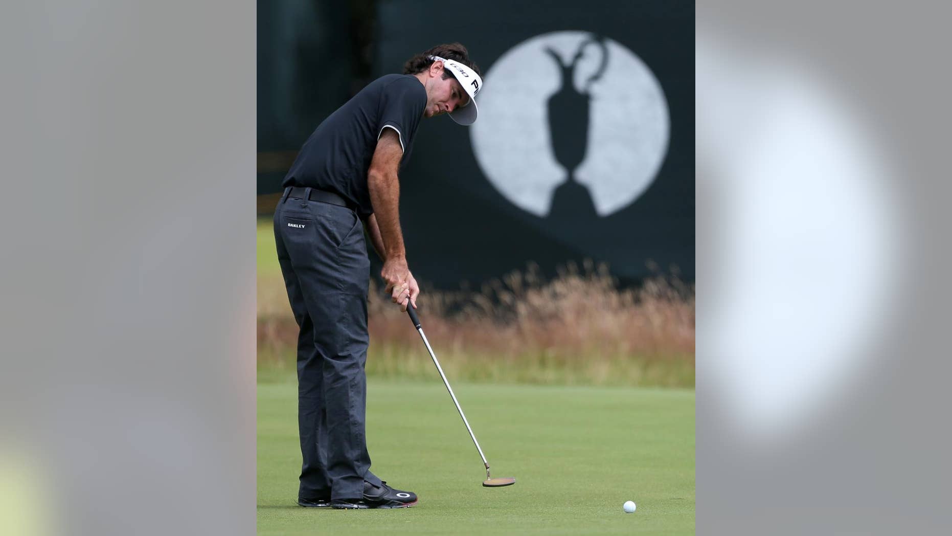 Bubba Watson of the US putts on the 16th green during a practice round ahead of the British Open Golf championship at the Royal Liverpool golf club, Hoylake, England, Wednesday July 16, 2014. The British Open Golf championship starts Thursday July 17. (AP Photo/Peter Morrison)