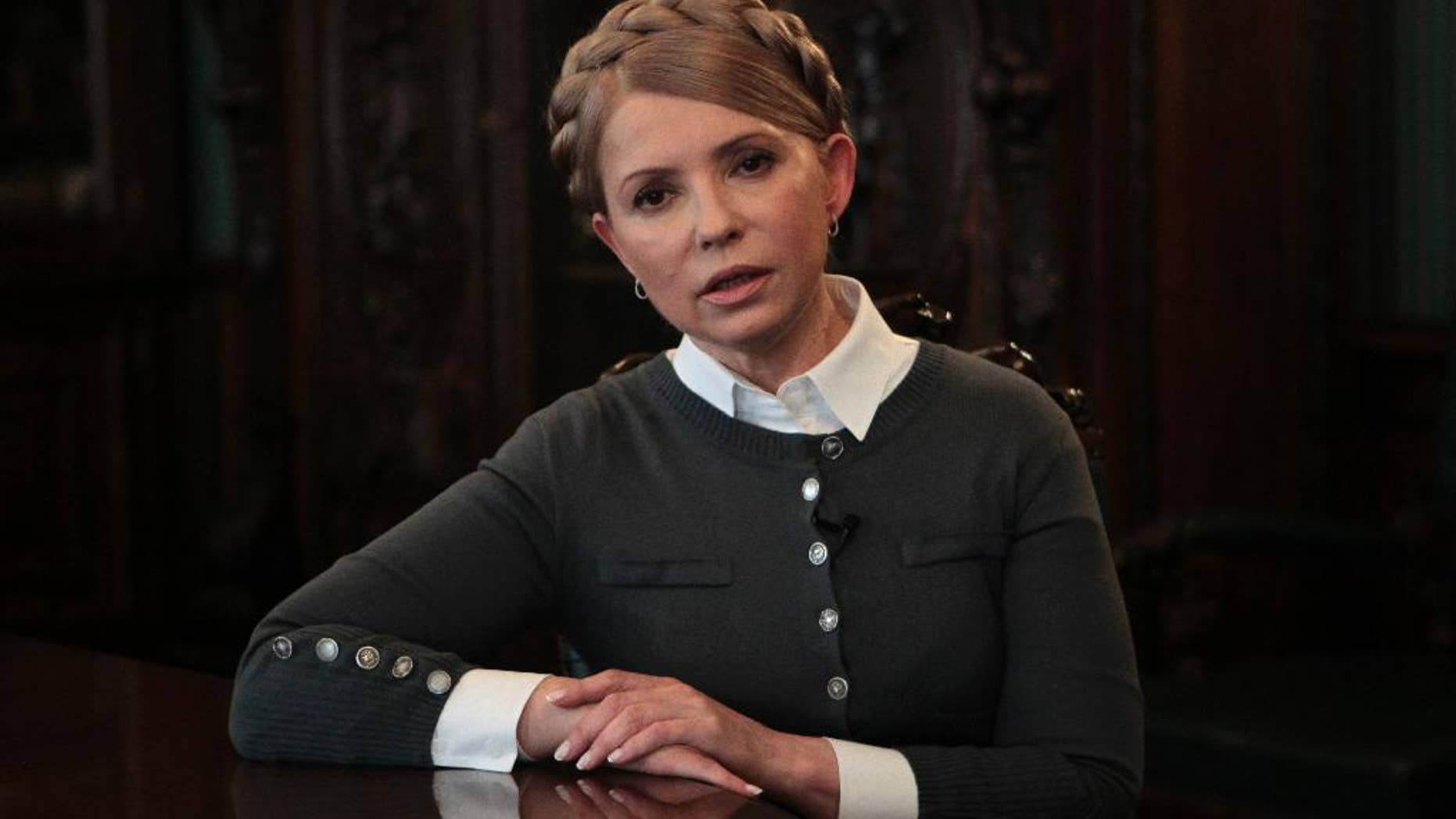 Former Ukrainian Prime Minister and candidate for the upcoming presidential elections Yulia Tymoshenko speaks during an interview with The Associated Press in Kiev, Ukraine, Saturday, April 26, 2014. Tymoshenko says Ukraine “must be a member of NATO” in order to protect itself from Russian aggression. While Tymoshenko has not previously backed NATO membership publicly, she and other Ukrainian politicians have ramped up the tough rhetoric as pro-Russia militias seized police stations and government buildings across eastern Ukraine. (AP Photo/Sergei Chuzavkov)
