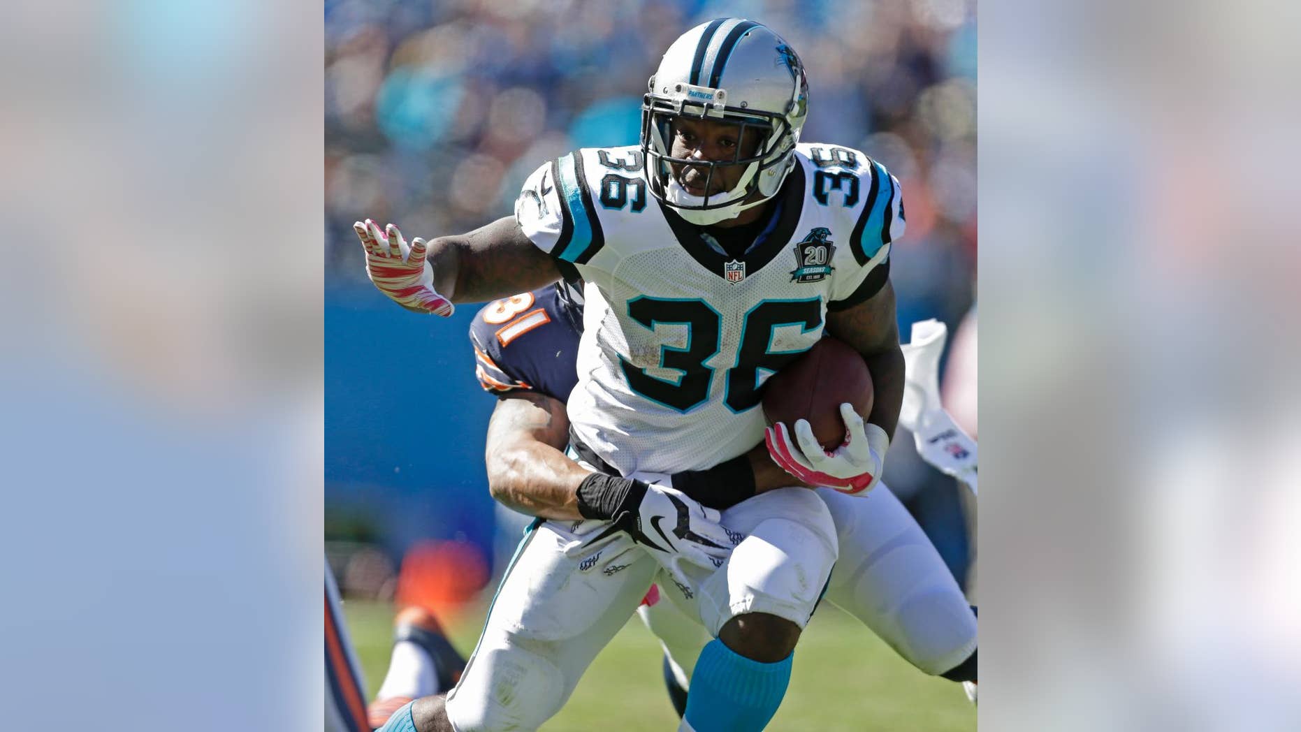 Carolina Panthers' Darrin Reaves (36) is tackled by Chicago Bears' Isaiah Frey (31) during the second half of an NFL football game in Charlotte, N.C., Sunday, Oct. 5, 2014. (AP Photo/Bob Leverone)