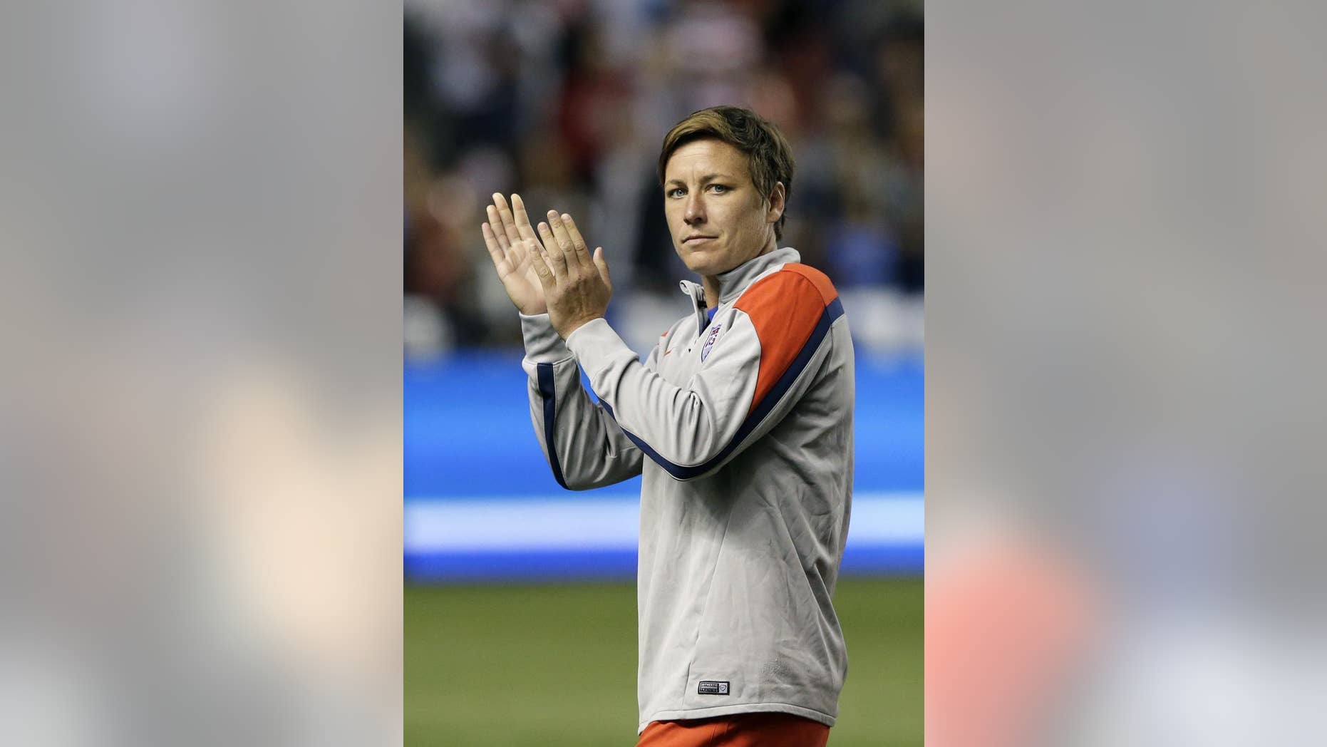 FILE - In this Sept. 13, 2014, file photo United States' forward Abby Wambach (20) walks off the field following an international friendly game with Mexico, in Sandy, Utah. A group of prominent international players led by U.S. forward Abby Wambach has withdrawn a complaint over artificial turf fields at this year's Women's World Cup in Canada. The artificial turf became a contentious issue with the players, who filed a complaint in Canada last fall that claimed the plan amounted to gender discrimination because the men's World Cup is held on grass. (AP Photo/Rick Bowmer, File)