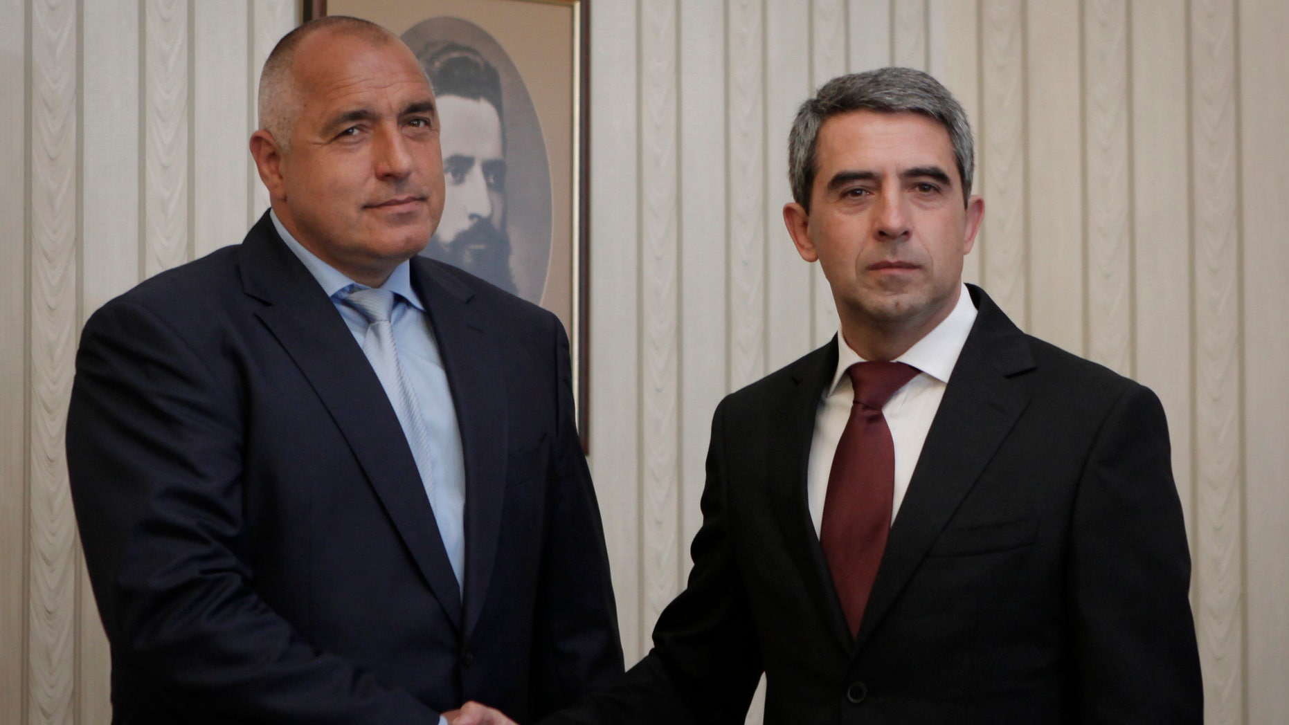 Bulgaria's President Rosen Plevneliev, right, poses with Boyko Borisov, Bulgaria's ex-prime minister and leader of the center-right GERB, left, prior to their meeting in Sofia, Friday, May 17, 2013. Bulgaria's Presidentl starst consultations with the four parties that will be represented in the new Parliament following last week's general elections. (AP Photo/Valentina Petrova)