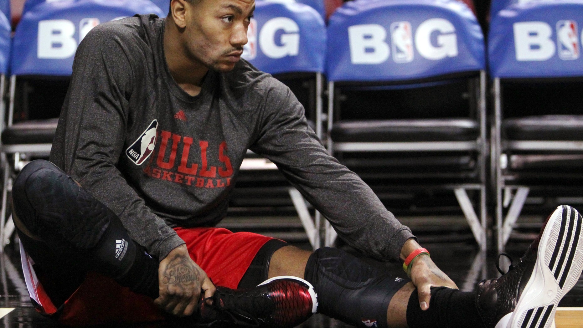 Chicago Bulls guard Derrick Rose stretches before an NBA basketball game against the Miami Heat in Miami, Sunday, April 14, 2013. The Heat won 105-93. (AP Photo/El Nuevo Herald, David Santiago) MAGS OUT