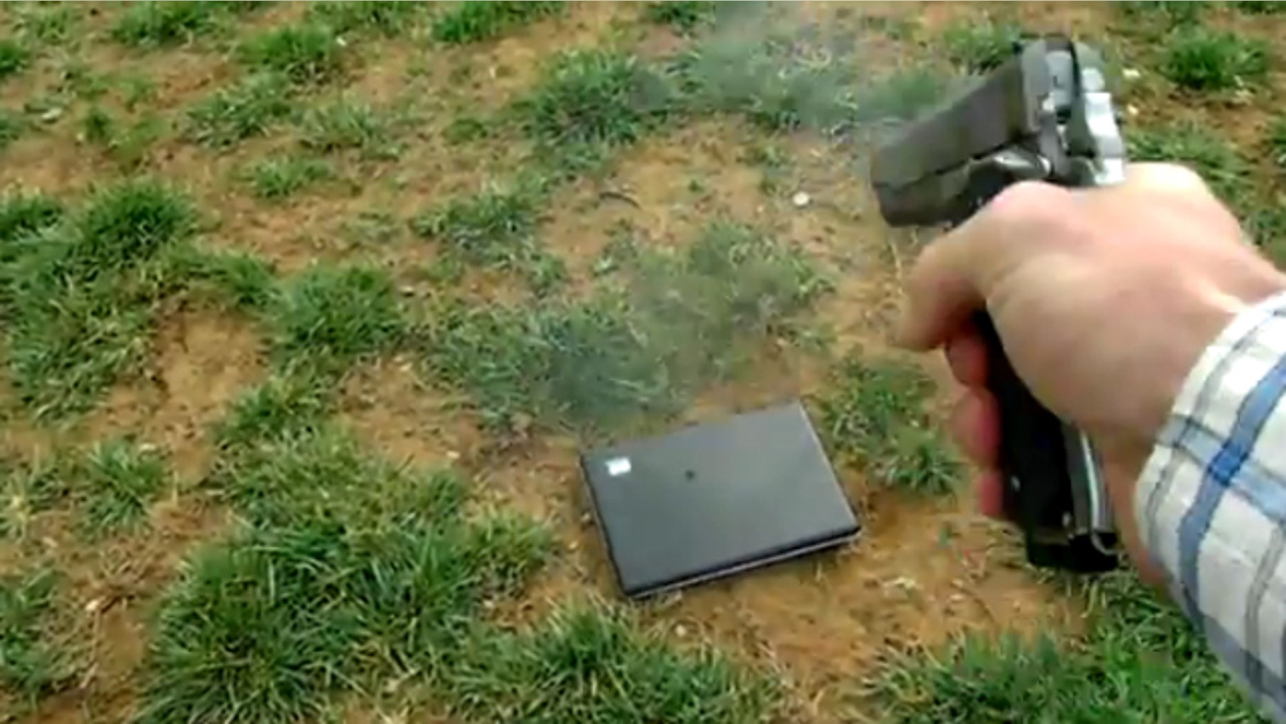 Tommy Jordan puts his daughter's laptop out of commission in this image taken from a video he posted online.