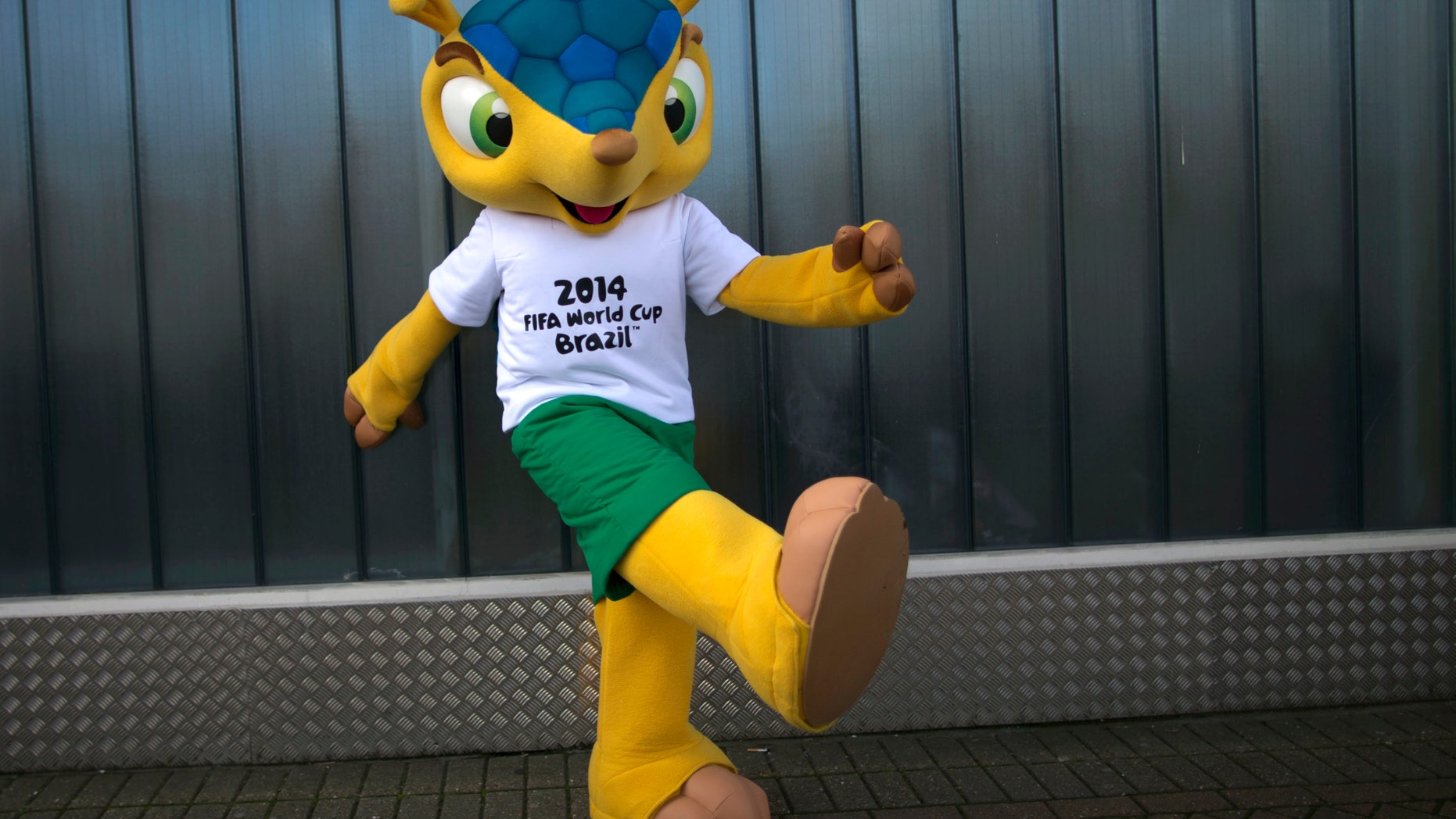 FILE - In this Oct. 16, 2012 file photo, the armadillo mascot for the 2014 World Cup in Brazil poses for photographs outside the Brand Licensing Europe 2012 exposition at Olympia in London. The Brazilian government will begin a program meant to save the endangered armadillo, the mascot for this year's World Cup, the Environment Ministry said Tuesday, Feb. 11, 2014. (AP Photo/Matt Dunham, File)