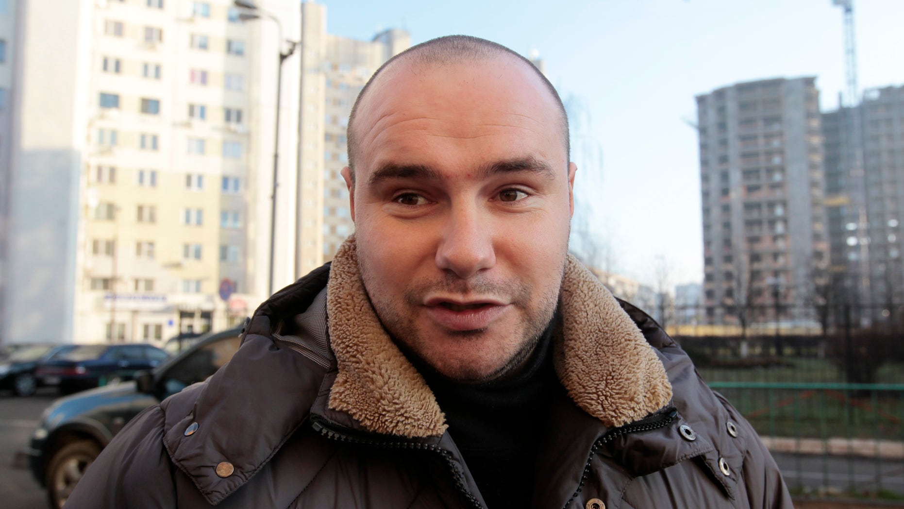 Volodymyr Maralov, 27, an activist with Road Control, speaks during an interview with the Associated Press in Kiev, Ukraine, Tuesday, Dec. 24, 2013. Last week, Maralov was dragged out of his car and shot point-blank in the chest with a rubber bullet that almost hit his heart. The attack followed the jailing of two other group members and the beating of another; one other member had fled the country. Road Control’s hundreds of members monitor abuses by the traffic police. The force’s alleged widespread corruption is one of many issues angering anti-government protesters who have gathered in central Kiev for massive demonstrations for more than a month. (AP Photo/Sergei Chuzavkov)