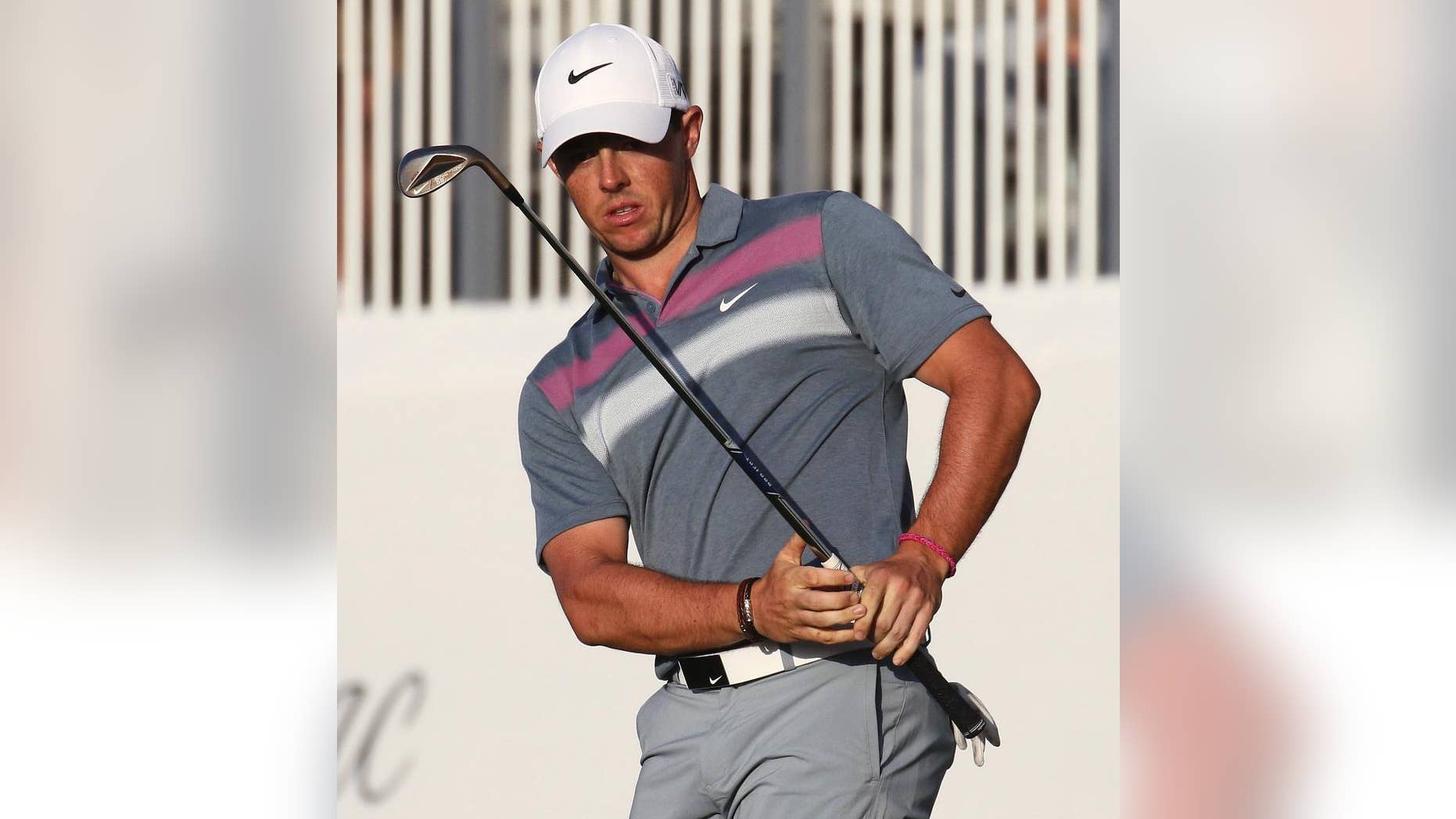 Rory McIlroy reacts after chipping onto the 18th green during the second round of the Cadillac Championship golf tournament in Doral, Fla., Friday, March 6, 2015. (AP Photo/J Pat Carter)