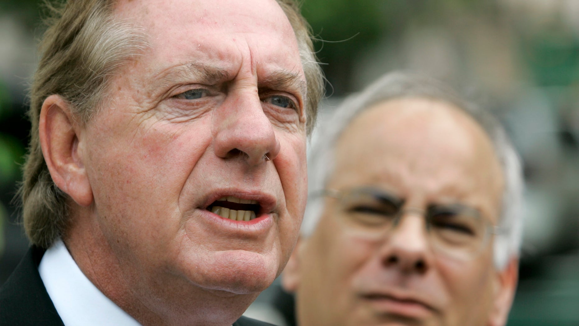 FILE - In this Monday, July 23, 2007 file photo, attorney Frank Rubino, left, talks to reporters as Jon May looks on during a news conference in Miami. Attorneys who handle terrorism and other notorious cases say public opinion is stacked against the defense for obvious reasons. Rubino, who represented former Panamanian dictator Manuel Noriega on drug conspiracy charges, agreed it wouldn't make sense to deny the younger Tsarnaev's involvement in the Boston Marathon bombings, but attorneys could try to spare his life by focusing on his age - 19 - and possible coercion by his older brother, Tamerlan, 26, who was killed Friday, April 19, 2013 in a fierce police shootout. (AP Photo/Alan Diaz)