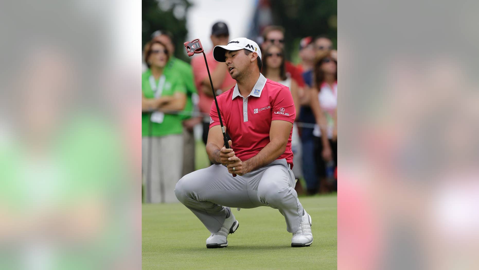 Jason Day, from Australia, reacts after missing a birdie putt on the 11th hole during the final round of the Bridgestone Invitational golf tournament at Firestone Country Club, Sunday, July 3, 2016, in Akron, Ohio. Dustin Johnson won the tournament. (AP Photo/Tony Dejak)