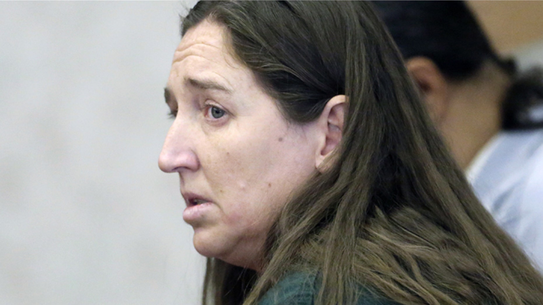 April 21, 2014: Megan Huntsman, accused of killing six of her babies and storing their bodies in her garage, appears in court in Provo, Utah.