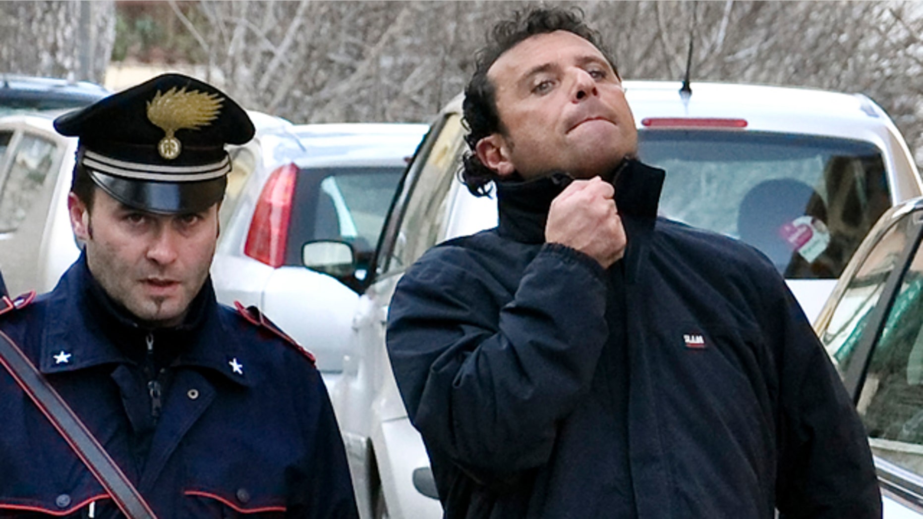 Jan. 14: Francesco Schettino, right, the captain of the luxury cruiser Costa Concordia, which ran aground off Italy's tiny Tuscan island of Isola del Giglio.