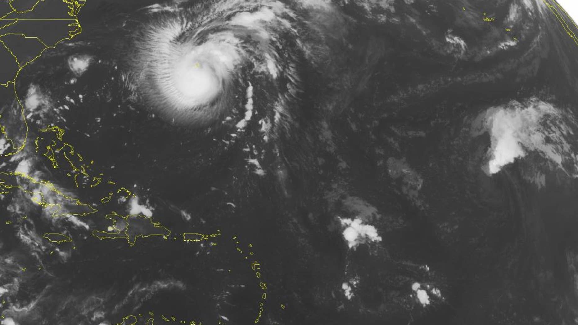 This NOAA satellite image taken Saturday, Sept. 24, 2016 at 12:45 AM EDT shows Tropical Storm Karl over Bermuda that is moving Northward. Karl is becoming more organized and expected to become a hurricane. To the South of Karl is mostly quiet weather over the Caribbean Islands with some isolated showers and thunderstorms. (NOAA/Weather Underground via AP)
