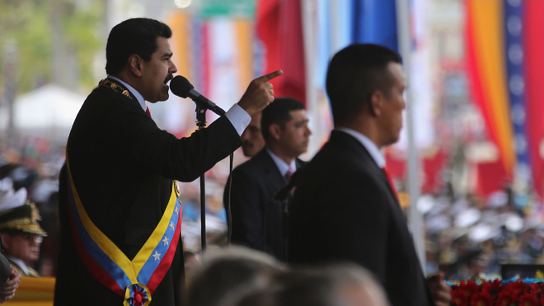 CARACAS, VENEZUELA - MARCH 05: Venezuelan President Nicolas Maduro speaks before a parade marking the first anniversary of Hugo Chavez's death on March 5, 2014 in Caracas, Venezuela. Thousands of pro-government supporters turned out to honor Chavez and listen to Maduro speak. During an anniversary speech, Maduro announed that Venezuela is cutting diplomatic and commercial relations with Panama, citing a conspiracy. (Photo by John Moore/Getty Images)