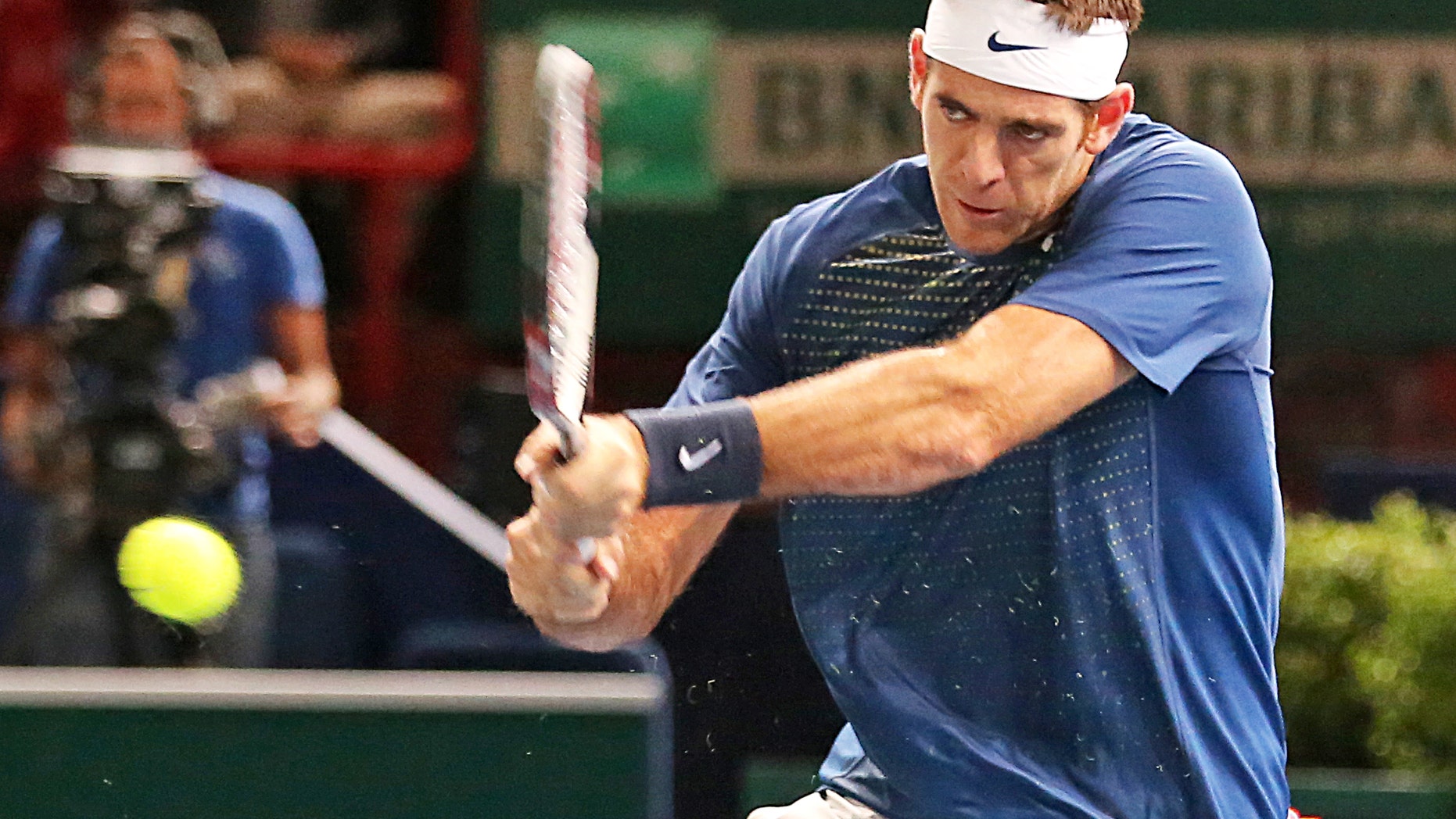 Argentina's Juan Martin Del Potro returns the ball to Croatian player Marin Cilic, during their second round match, at the Paris Masters tennis, in the Paris Bercy stadium, Wednesday Oct. 30, 2013.(AP Photo/Remy de la Mauviniere)